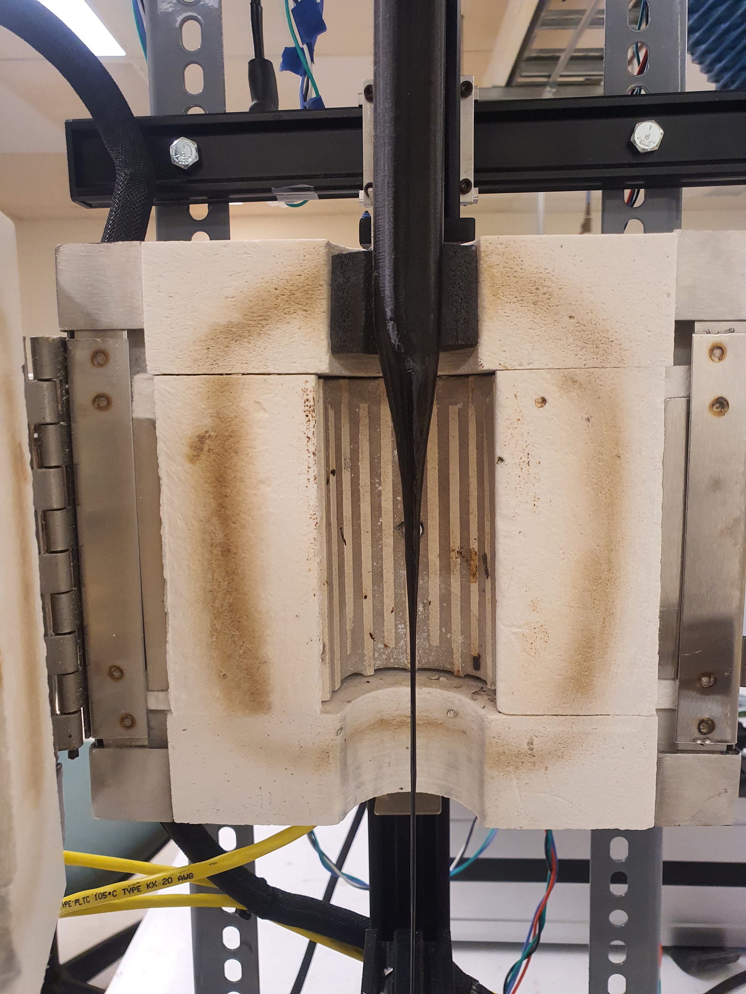 PETG Preform being drawn into fiber