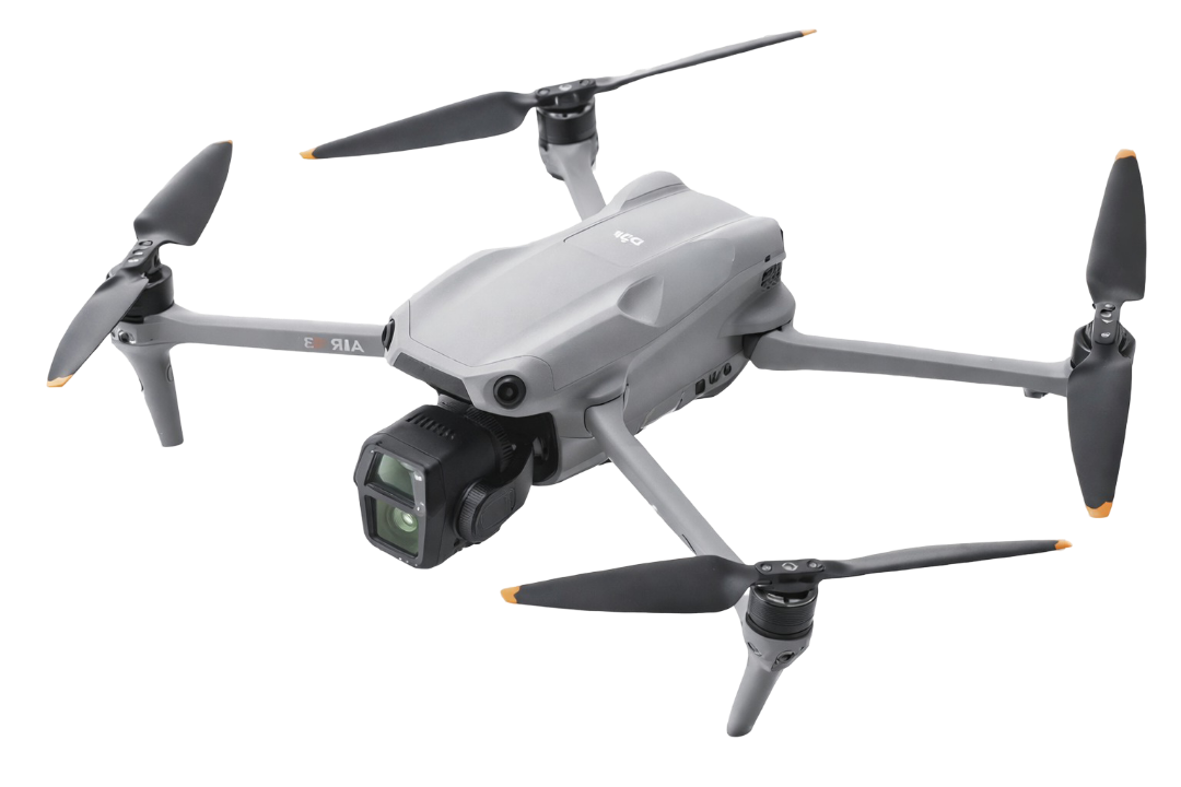 A gray quadcopter drone with four propellers, camera mounted underneath, and aerodynamic body design.