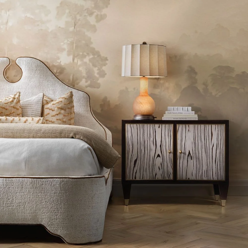 The Light Hearted Lamp has multiple lighting options. The three-way socket switch offers generous ambient light and the smoky alabaster glass body has an LED light with dimmer knob located in the copper bronze-finished base