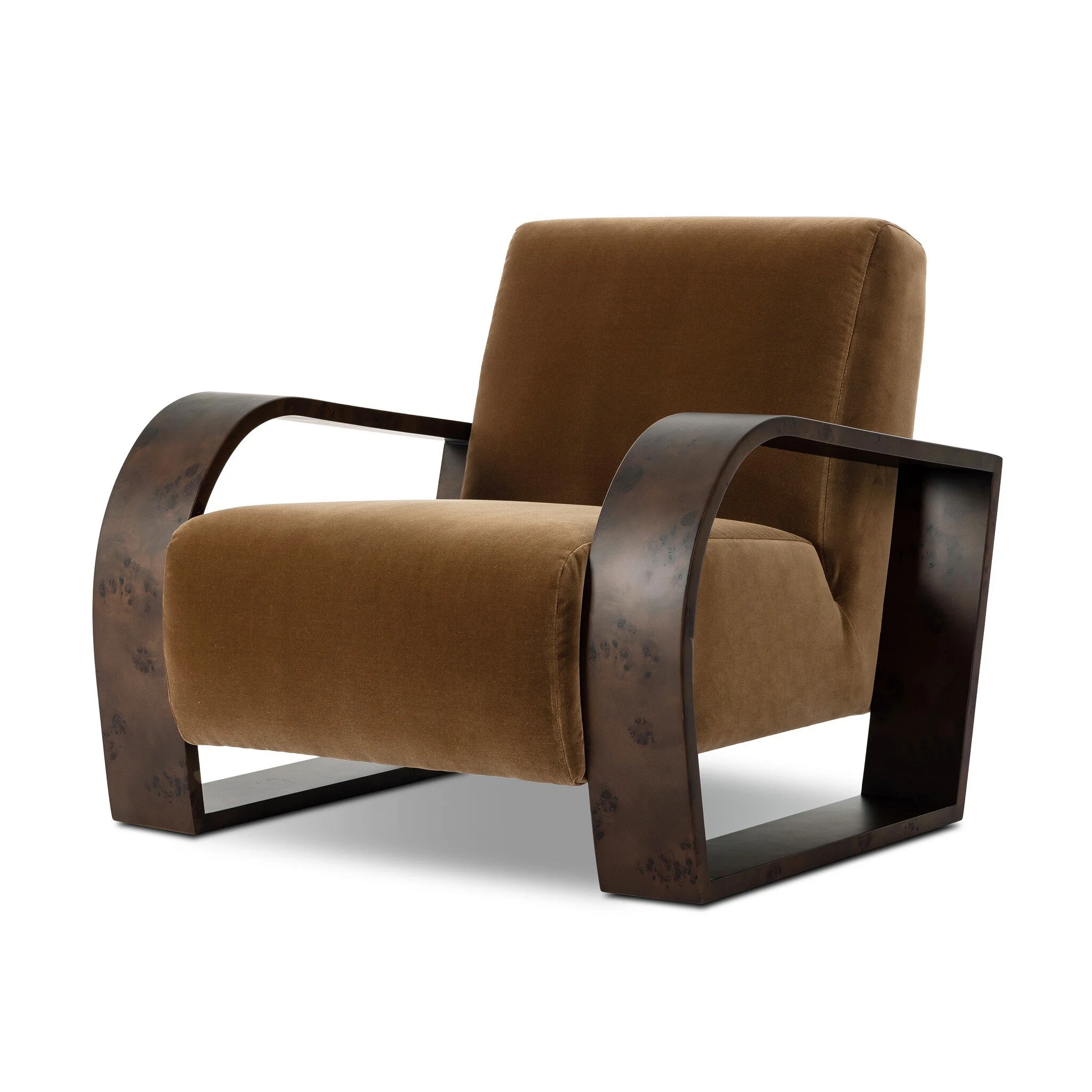 A luxe material mix at play. Deep plush seating in a high pile velvet is paired with an exaggerated 1920s Art Deco-inspired frame. Its bentwood arms are sculpted from mappa burl for extra movement throughout the piece.