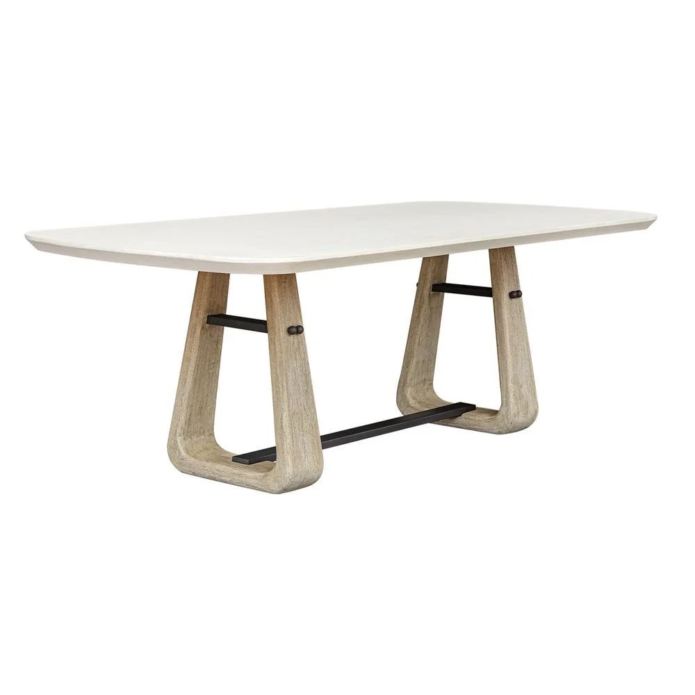 A durable warm white GRC tabletop rests upon cerused wheat mahogany legs with striking java black metal accents. 