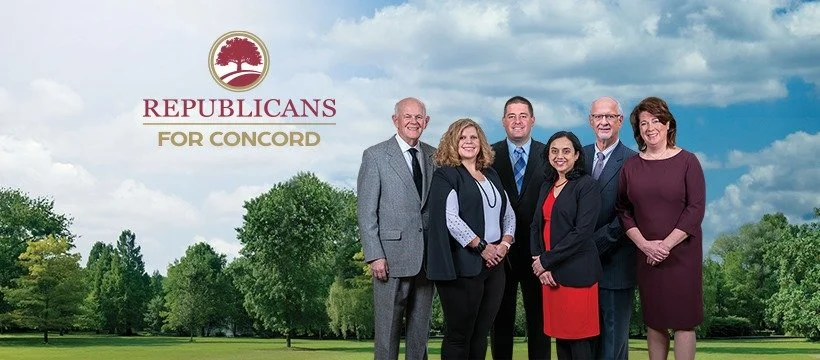 Group of six people standing outdoors on a grassy field with trees and a cloudy sky in the background. A logo with a red tree and the text 'REPUBLICANS FOR CONCORD' is in the upper left corner.
