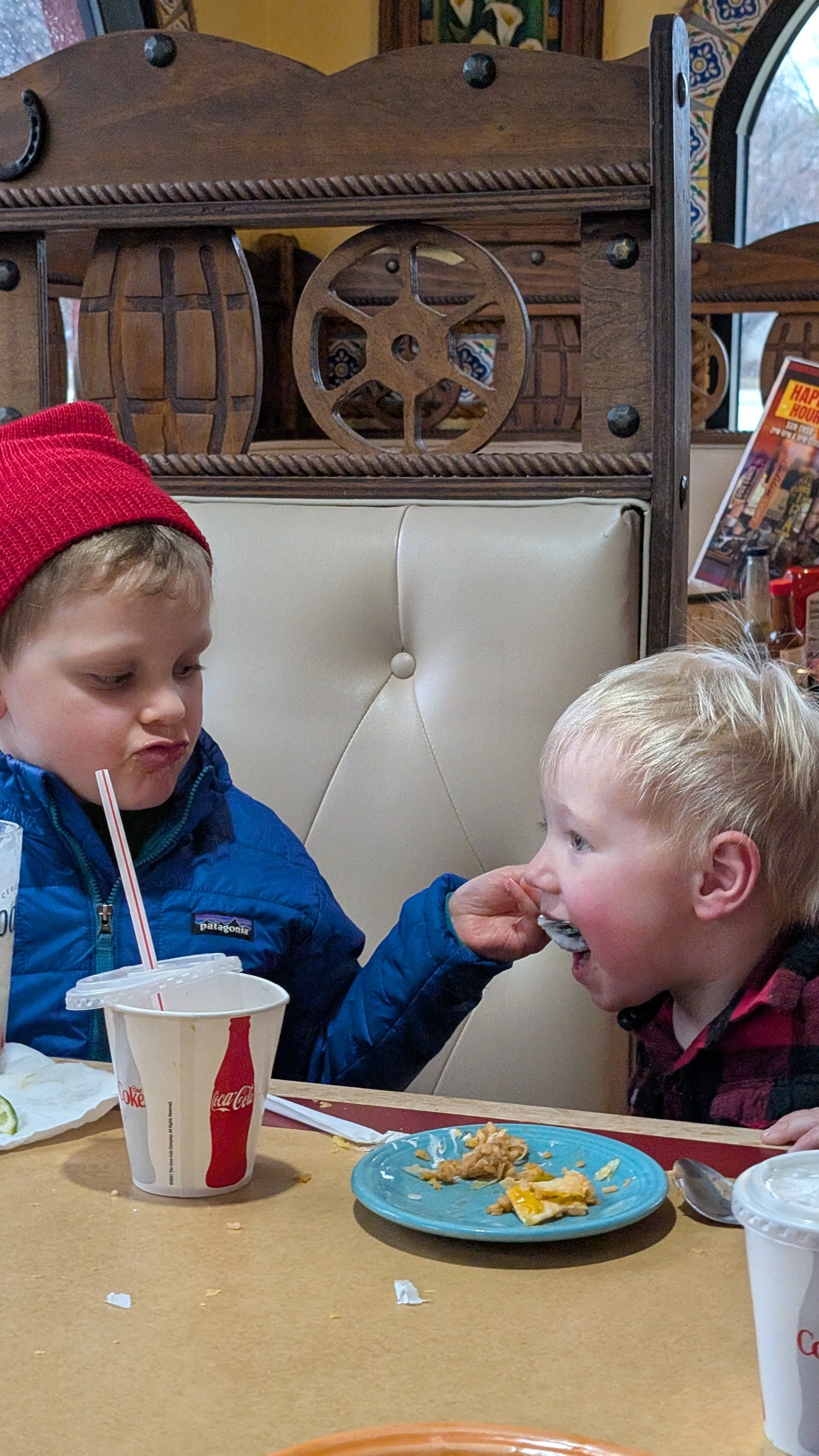 Older cousin (aka 5) feeding ice cream....what can go wrong.....it ended up down Matthews shirt! lol