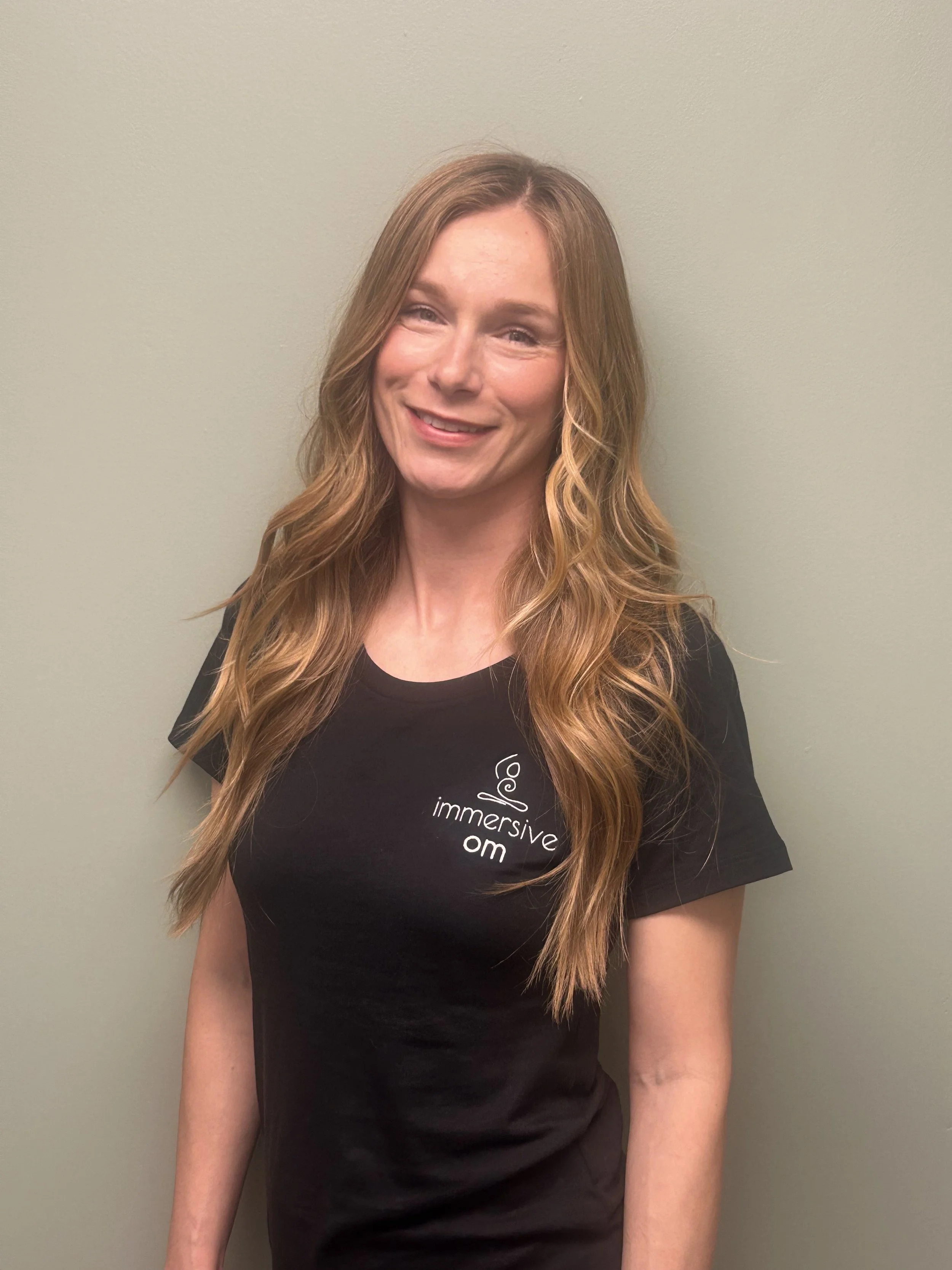 Ania somatic yoga teacher at immersive Om Yoga Pilates and wellness studio
