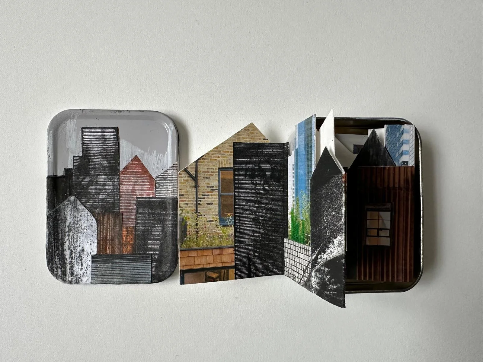 Untitled:
Mixed media concertina cityscape on paper in metal tin.
1/1
Concertina dimensions: 10cm x 49cm.
Tin dimensions: 8cm x 11cm x 3cm.