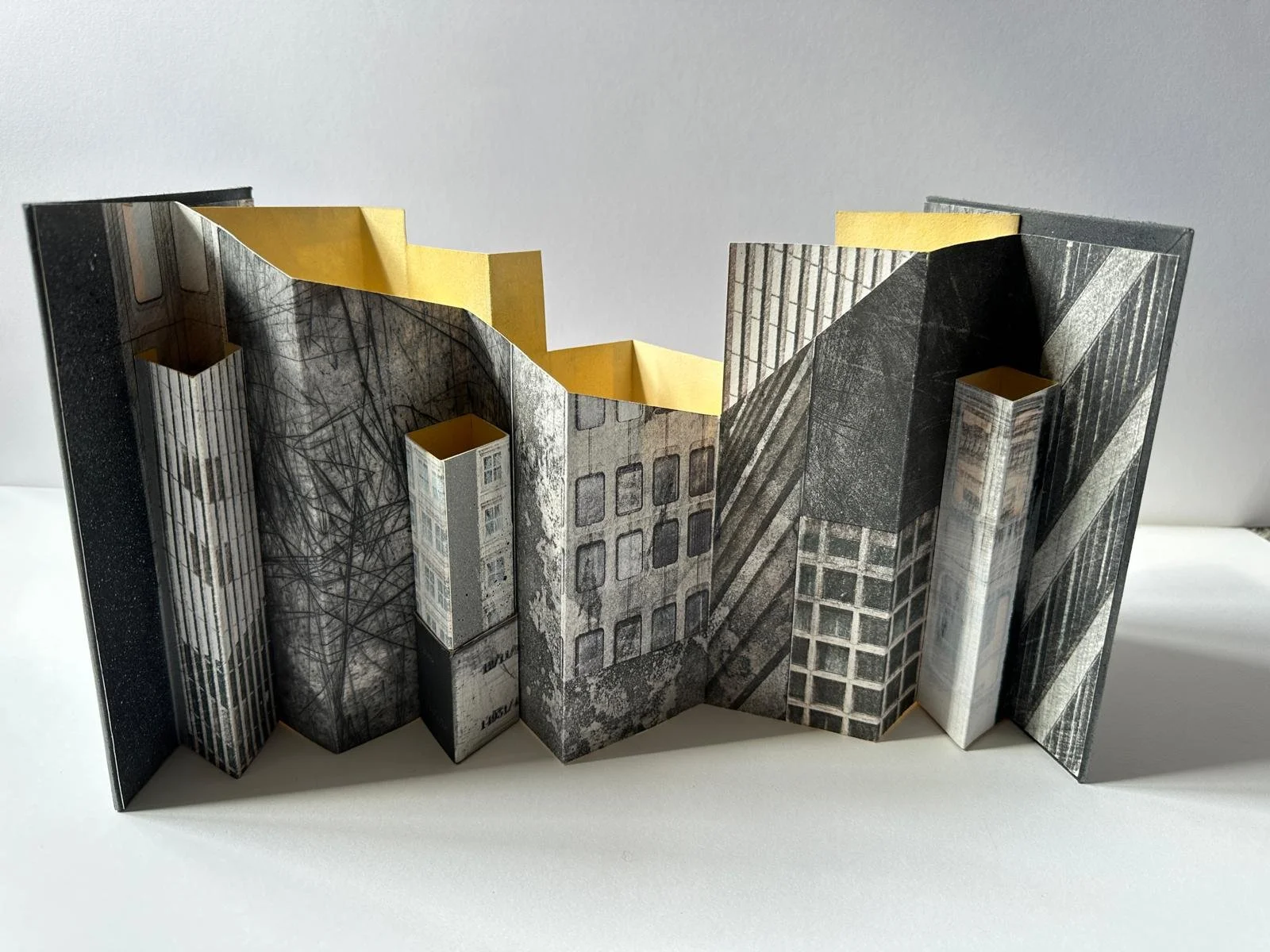 Concrete and Shadows:
Mixed media - Drypoint, etching and aquatint, drawing, painting and spraypaint.
Cover dimensions: 15 x 20cm
Book length when fully opened out - 35cm
