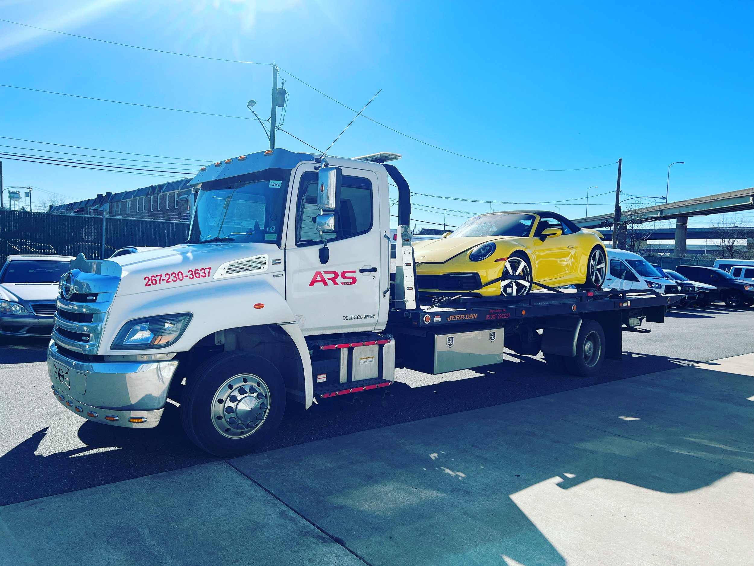 ARS Towing flatbed tow truck providing 24/7 emergency vehicle towing in Newtown, PA