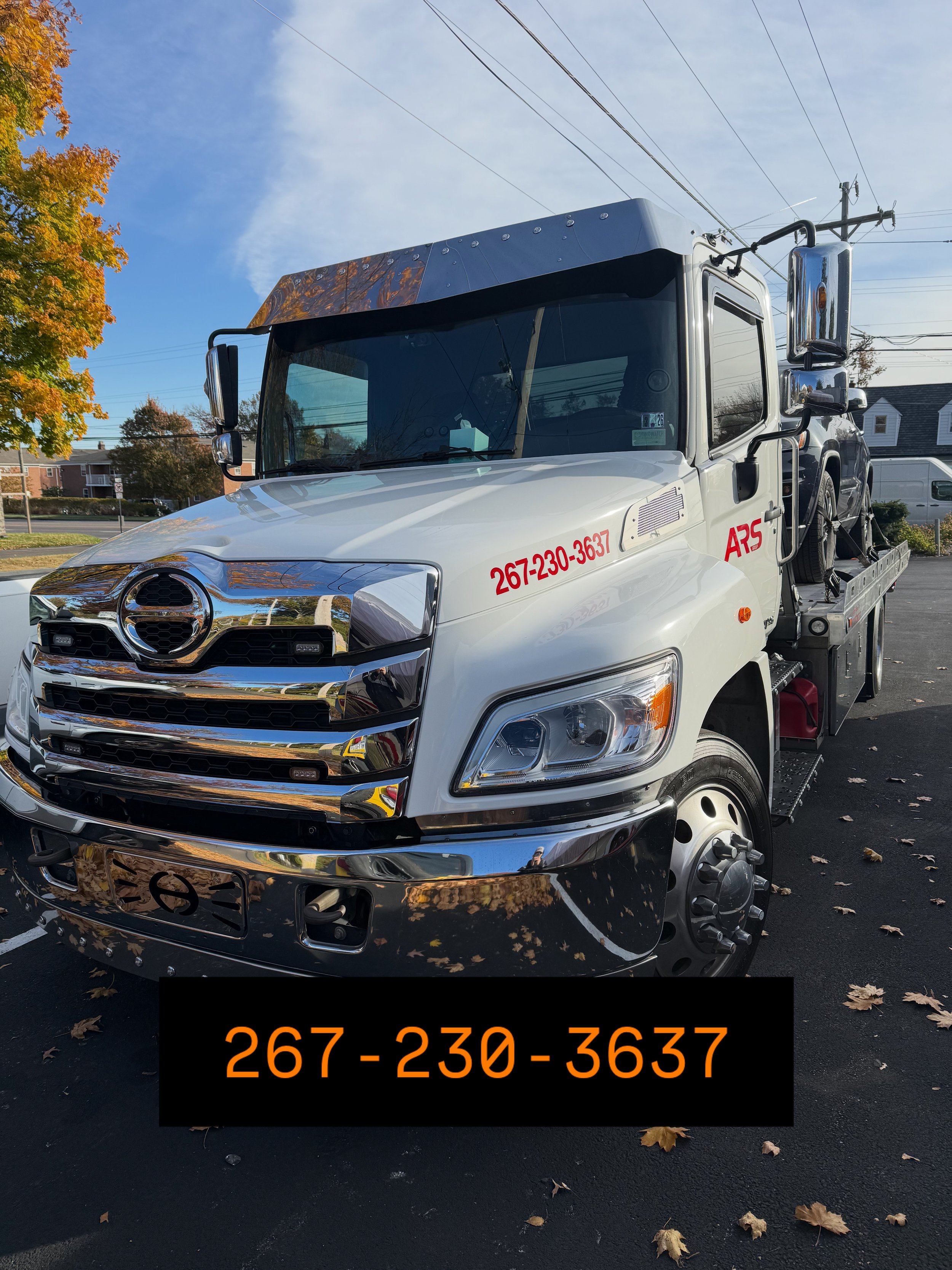 ARS Towing flatbed tow truck providing 24/7 emergency roadside assistance and vehicle recovery in Philadelphia and Southampton, PA.