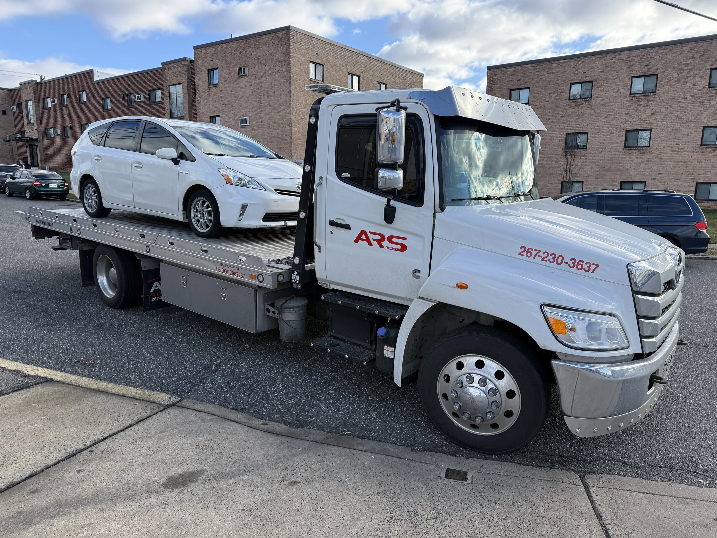 ARS Towing flatbed tow truck providing 24/7 emergency vehicle towing in Northeast Philadelphia, PA
