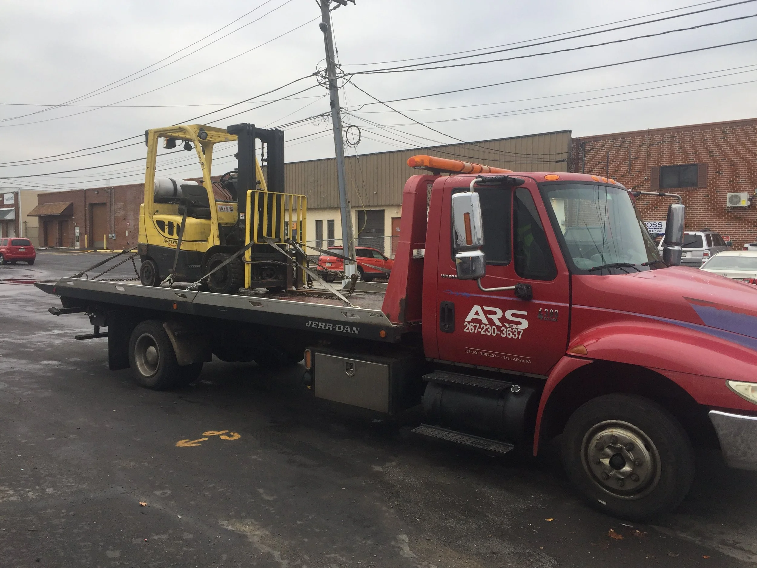 ARS Towing flatbed tow truck providing 24/7 emergency roadside assistance and vehicle recovery in Philadelphia and Southampton, PA.