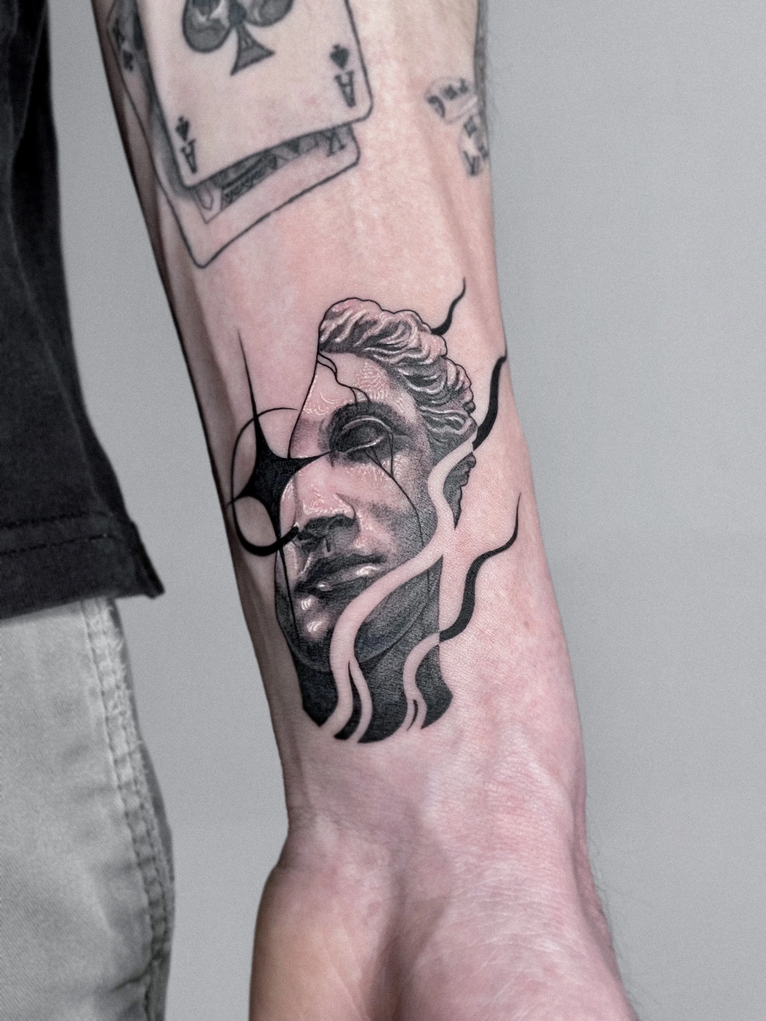 Tattoo of a classical statue head by Dmytro Shcherbakov