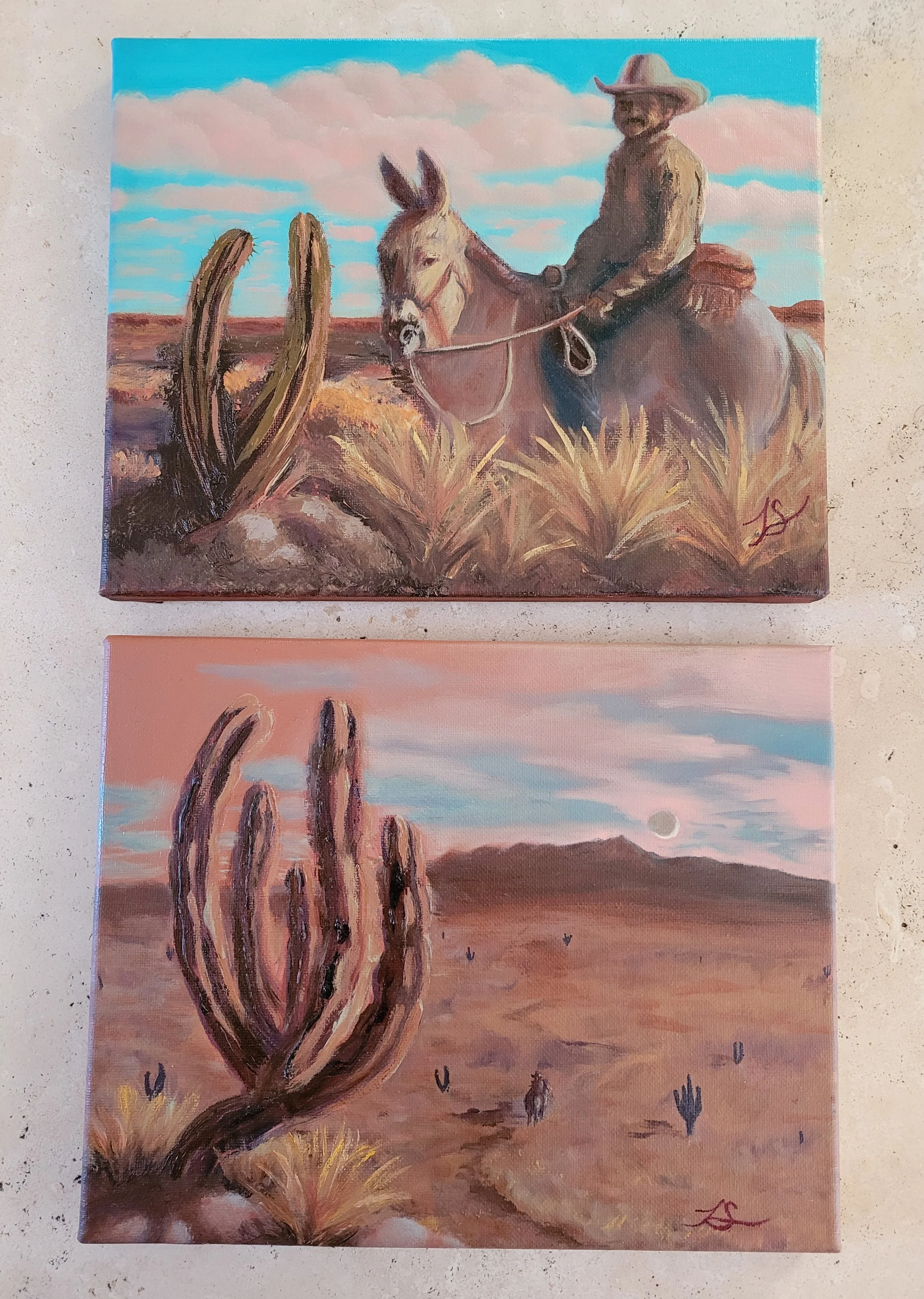 cowboy and cactus in sepia tones with bright blue sky with pink fluffy clouds