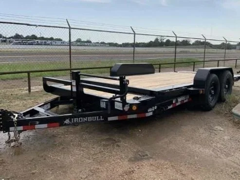 Tilt deck equipment trailer with wood deck and dual axle design for loading machinery and vehicles, available for rent at McKinleyville Ace Home & Garden Center.