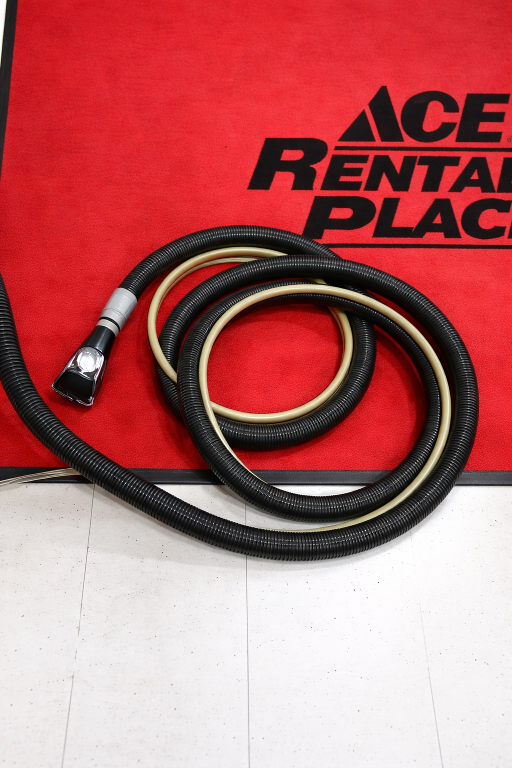 Carpet cleaner hose with upholstery extraction tool, available for rental at McKinleyville Ace Home & Garden Center.