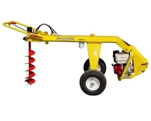 Towable hydraulic earth auger with gas engine and spiral drill bit for digging post holes, available for rent at McKinleyville Ace Home & Garden Center.
