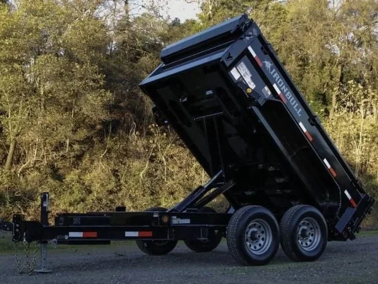 7x12 dump trailer with hydraulic lift bed and dual axle design for hauling and dumping materials, available for rent at McKinleyville Ace Home & Garden Center.