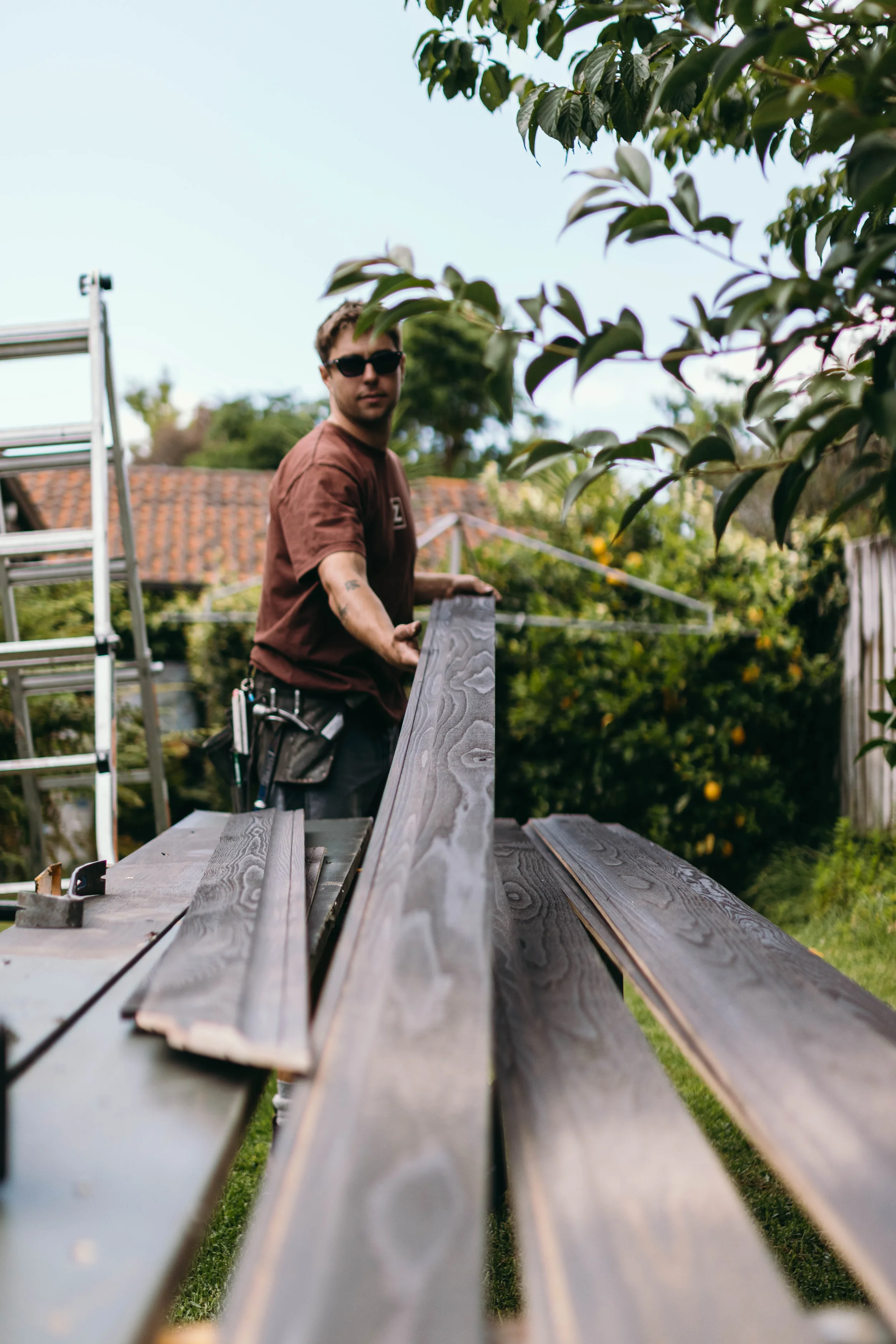 Bay of Plenty builders installing cedar cladding in a modern home renovation.
