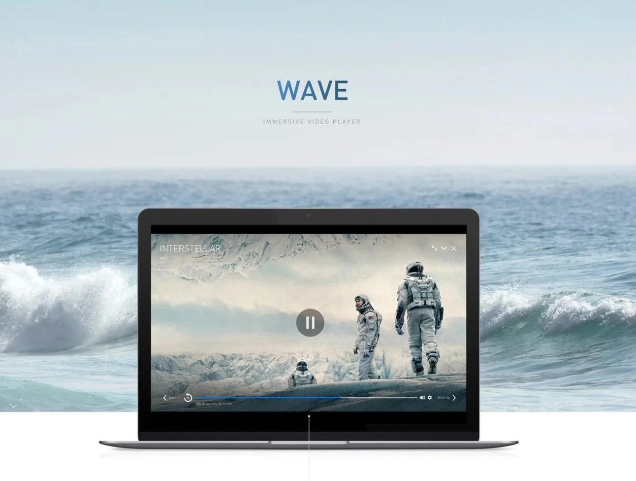 A laptop displaying a video of astronauts on icy terrain with ocean waves in the background.