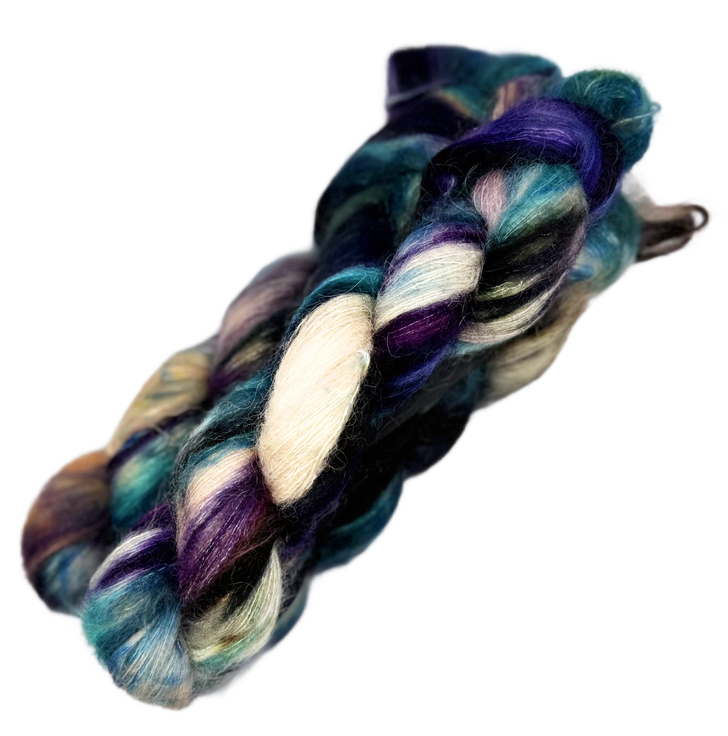 Multicolored yarn hand dyed with shades of purple, blue, cream, and teal on a plain white background.