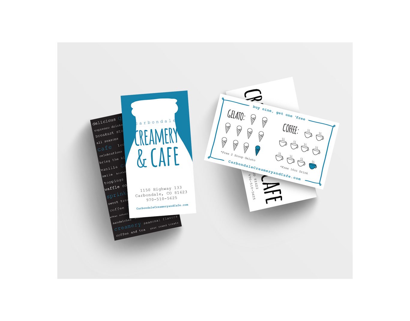 Business cards for Carbondale Creamery & Cafe, featuring their address, phone number, website, and menu items like gelato and coffee, with a stylized logo and promotional offers.