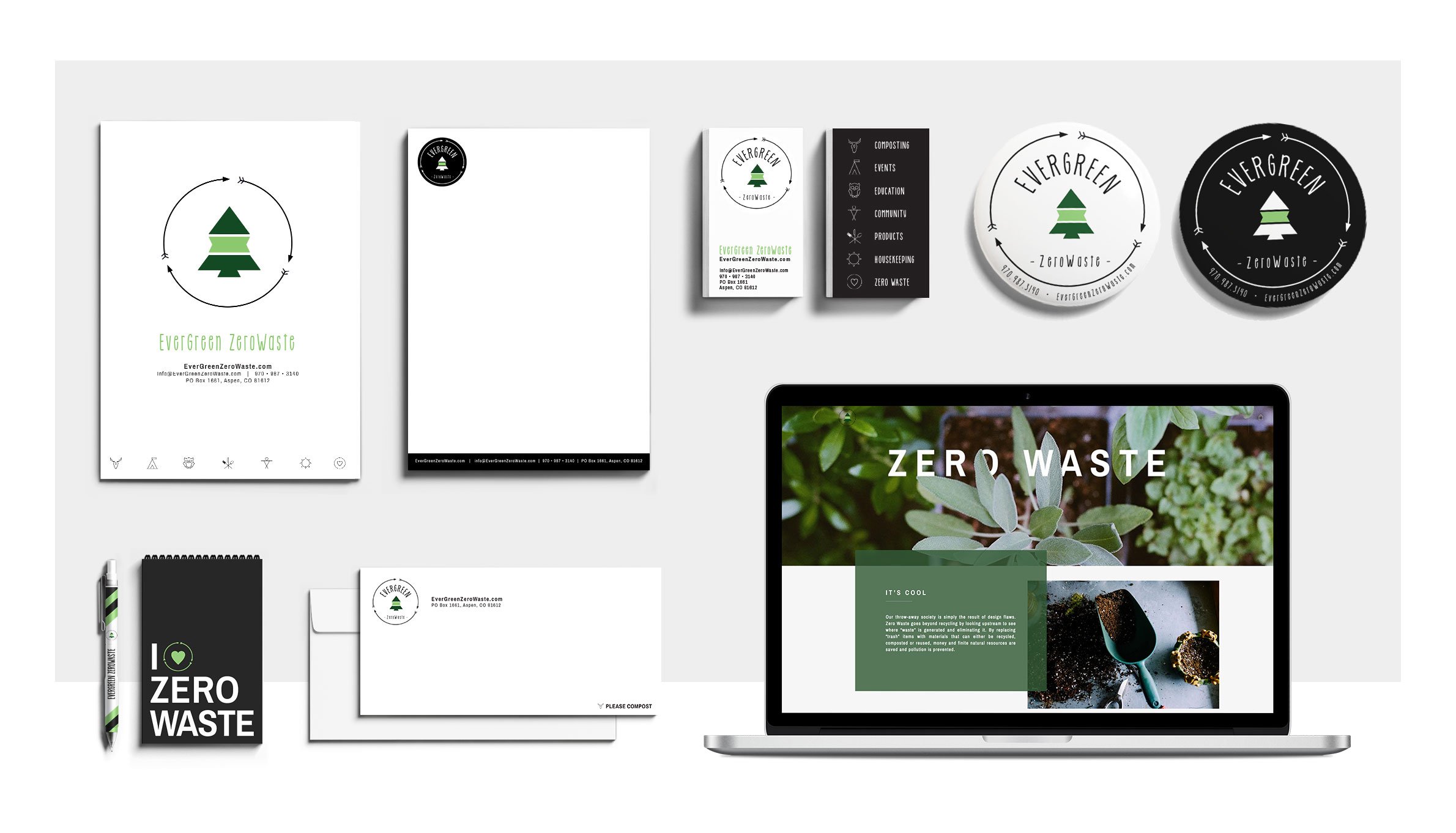 Collection of branding materials for Evergreen ZeroWaste, including business cards, stickers, notebooks, envelopes, pens, and a laptop displaying a zero waste website.