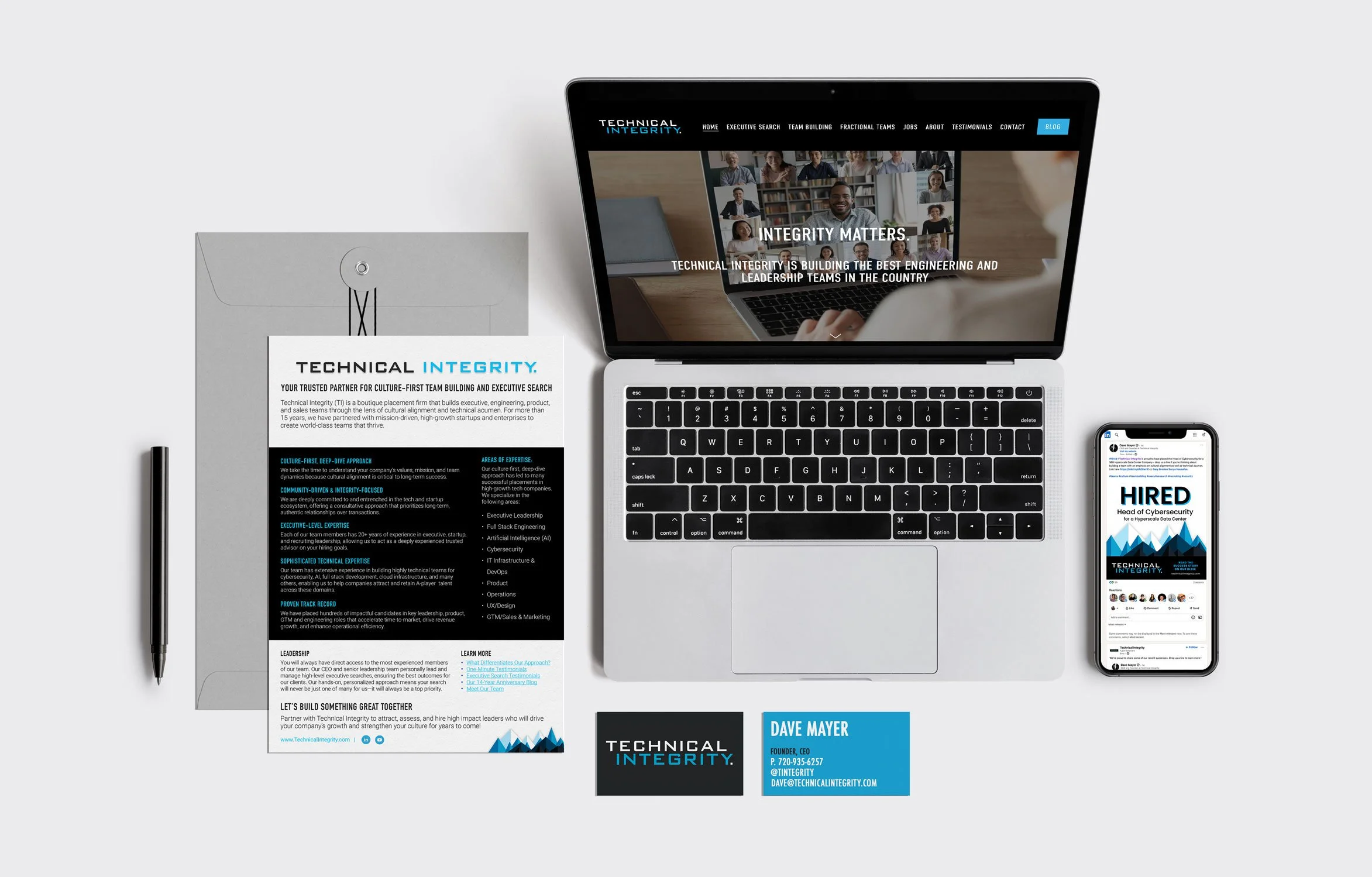 A laptop computer displaying the Technical Integrity website on its screen, a smartphone showing one of their 'HIRED' social media posts, their businesses cards and a one-page flyer about the company. This image shows brand consistency.