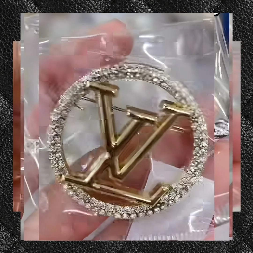 LV inspired brooch