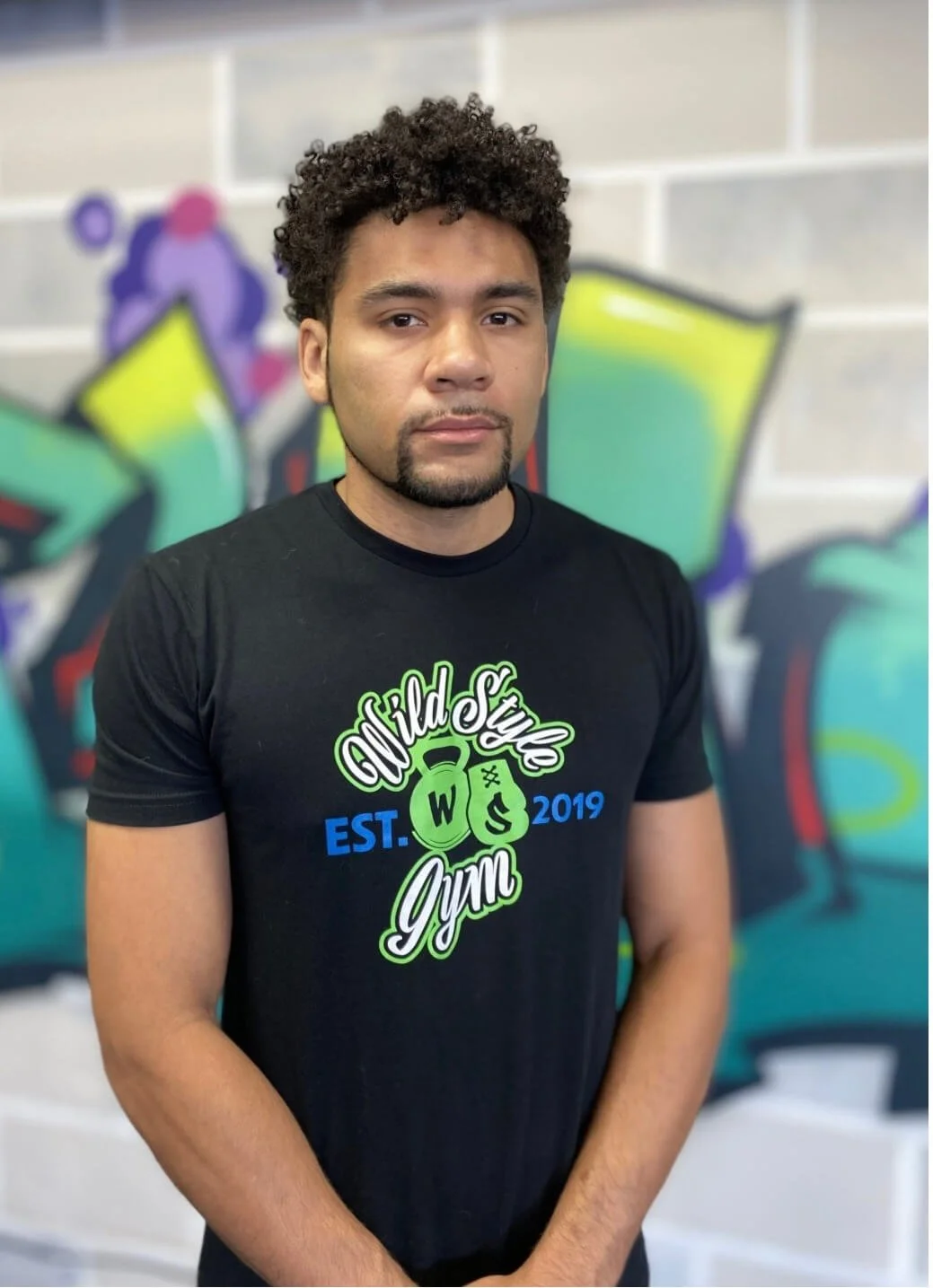 Coach Dex of WildStyle Gym stands inside the training facility, representing discipline, strength, and high-level coaching that supports athletes and everyday members in Snohomish, Washington.