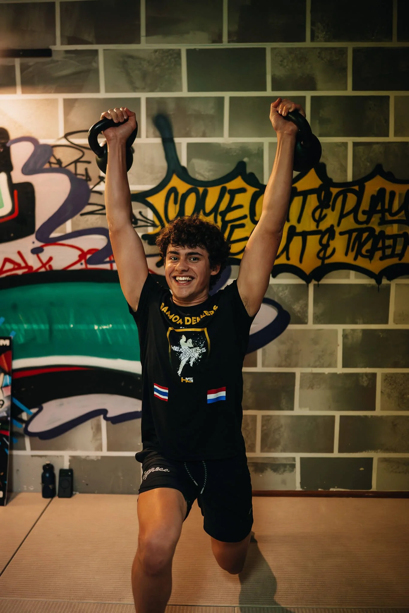 Athlete performing a kettlebell overhead lunge during Champion Strength training at WildStyle Gym in Snohomish, WA.