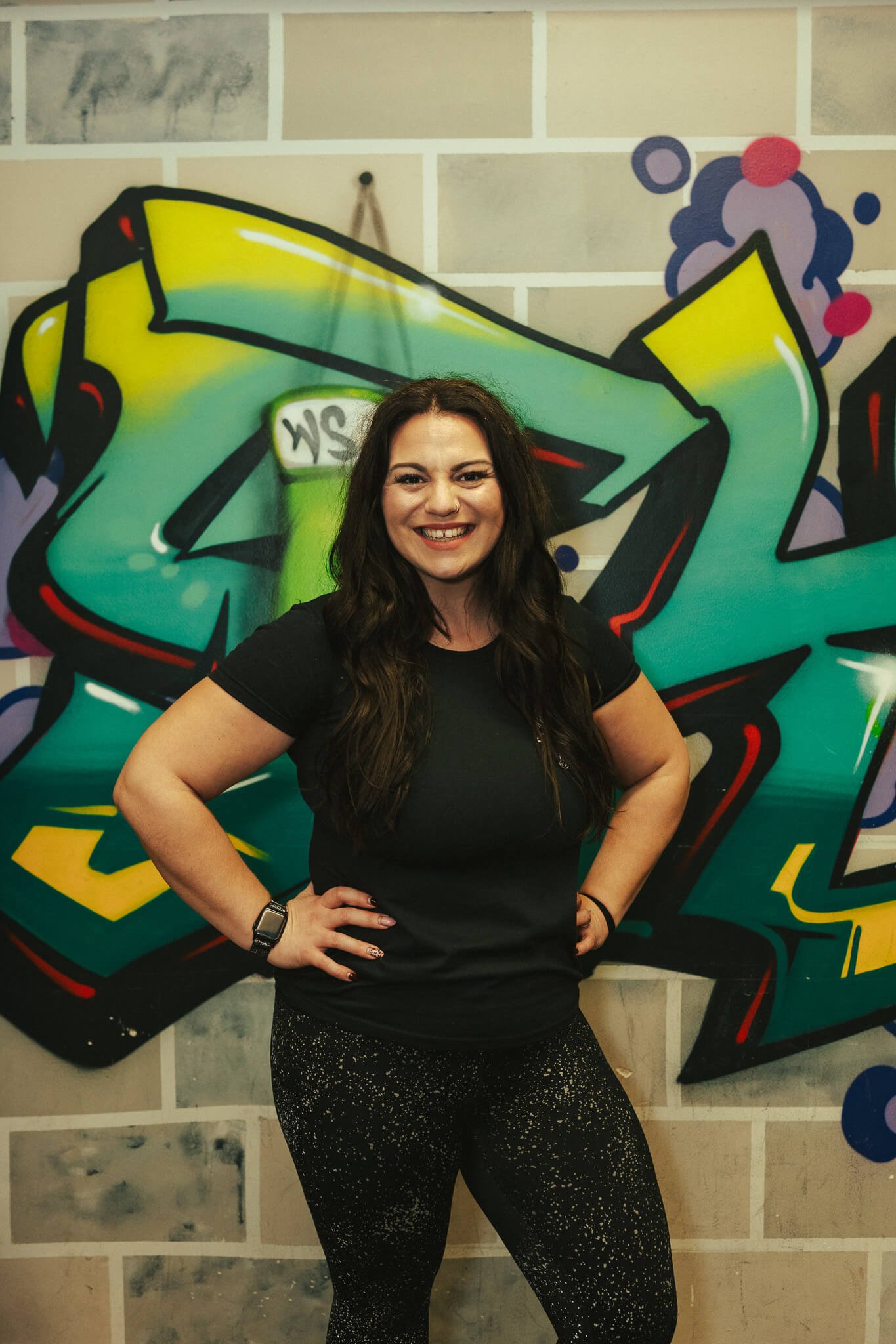 Coach Alyson, fitness coach at WildStyle Gym in Snohomish, WA, leading strength and conditioning training with confidence and positivity.