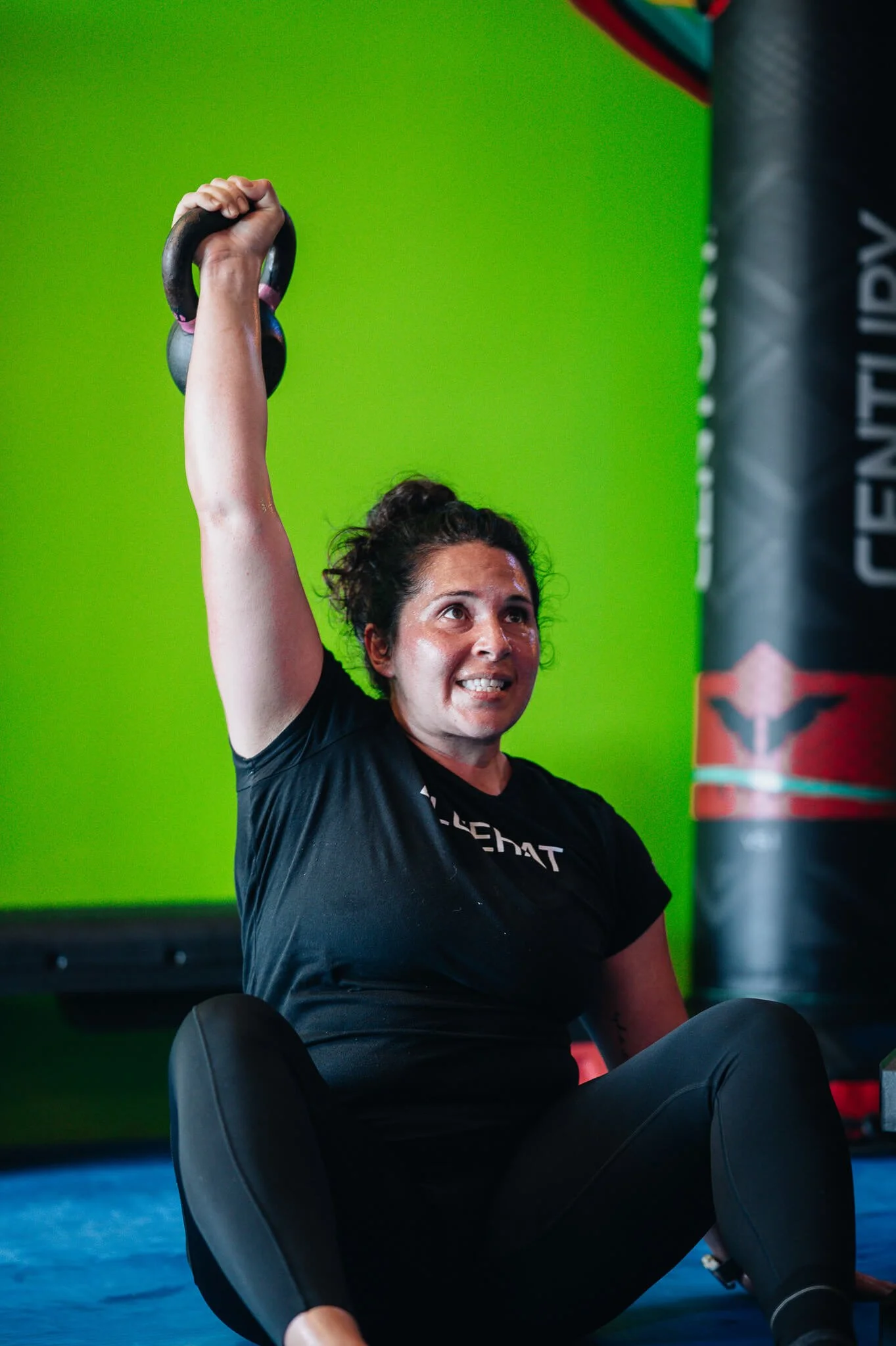 Champion Strength small group training at WildStyle Gym featuring a kettlebell core and shoulder exercise in Snohomish, Washington