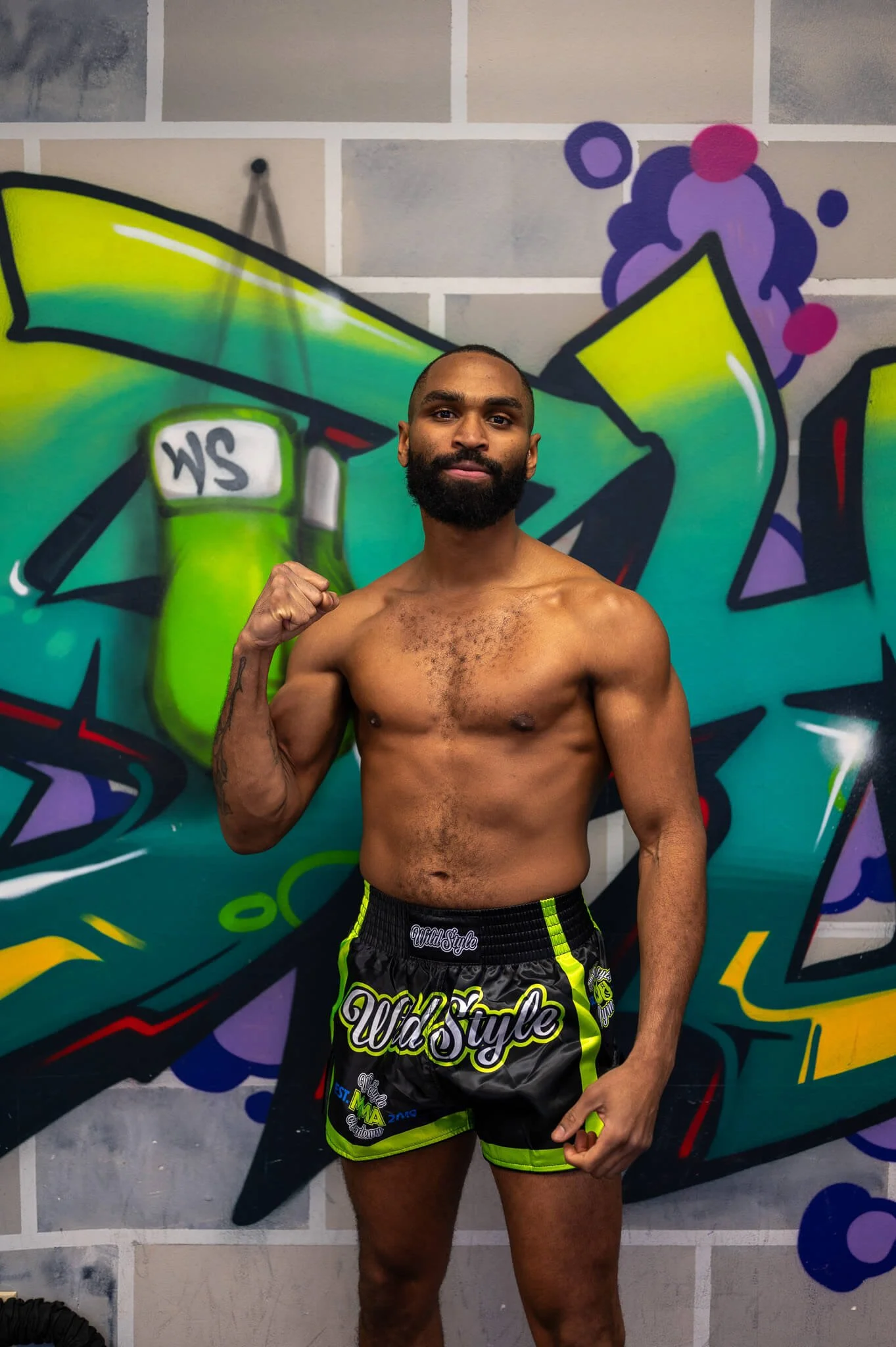 Coach Joey in a fighter stance at WildStyle Gym in Snohomish, WA, showcasing strength, conditioning, and martial arts training.