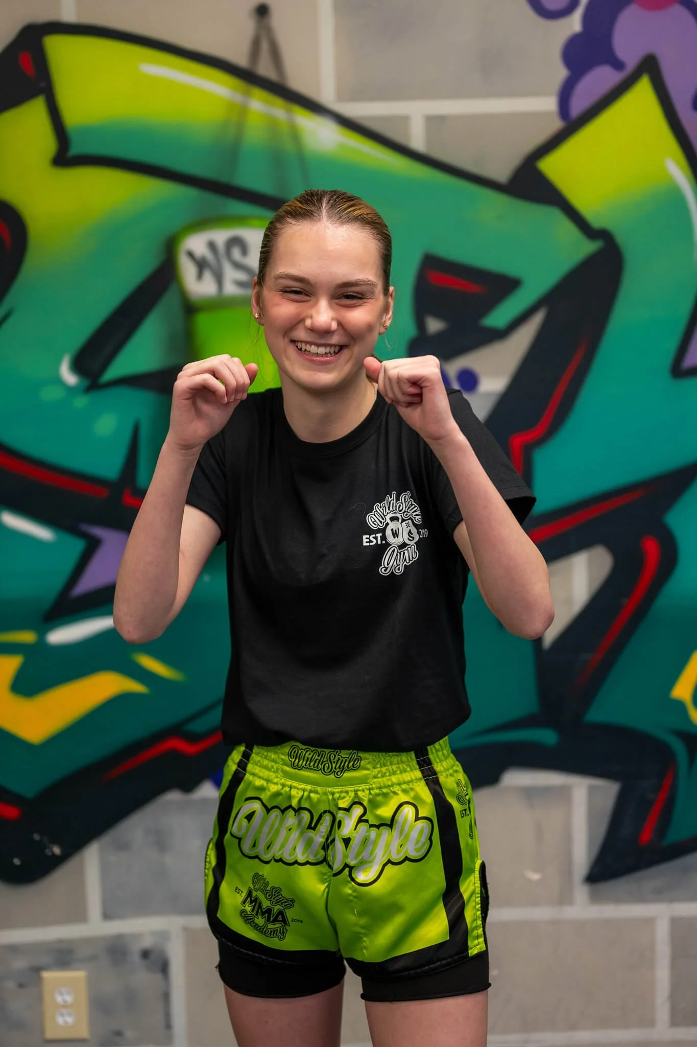 Assistant Coach Katelynn at WildStyle Gym in Snohomish, WA, helping lead kids martial arts and fitness classes in a positive environment.