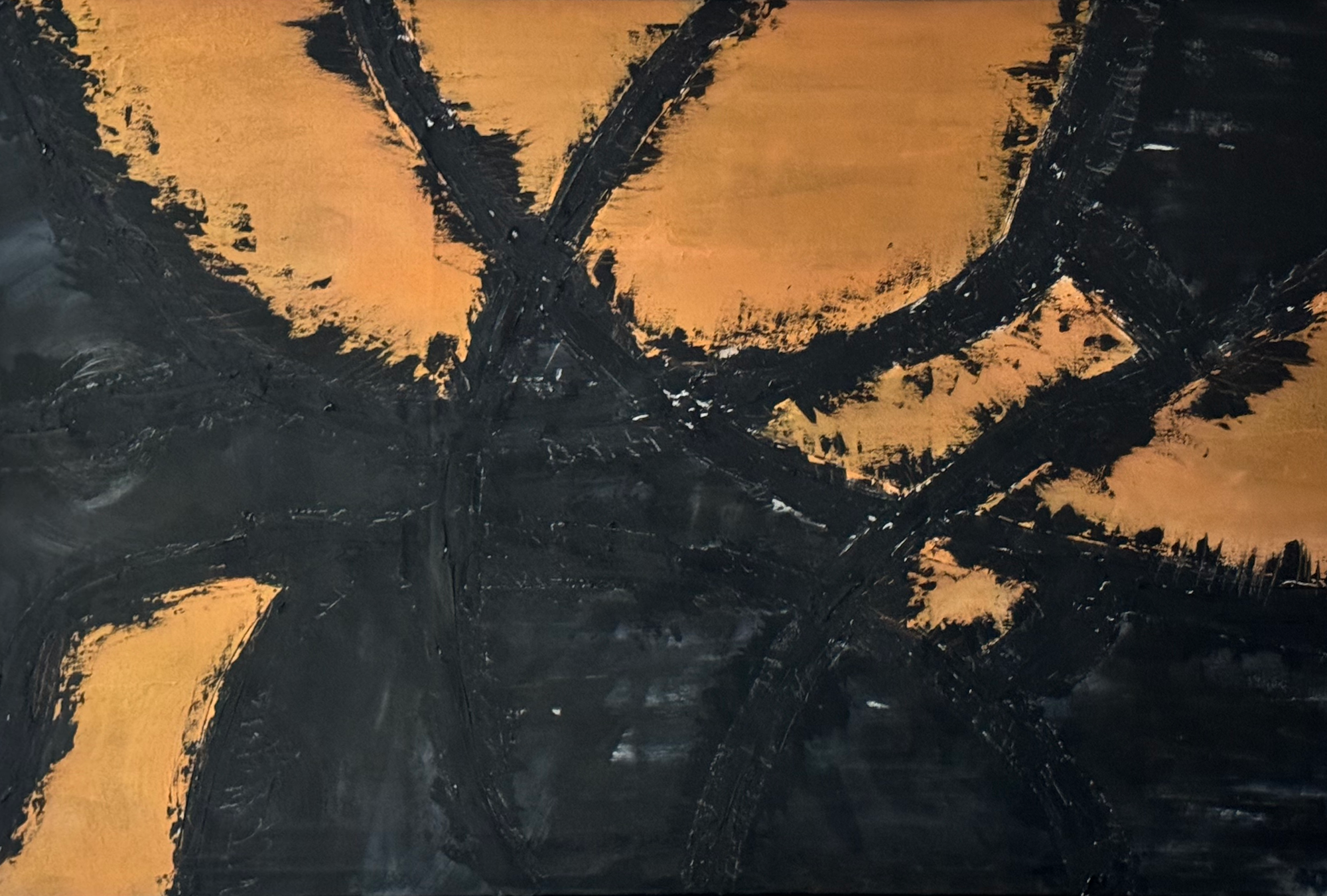 Abstract painting with black brushstrokes on a orange and yellow background.