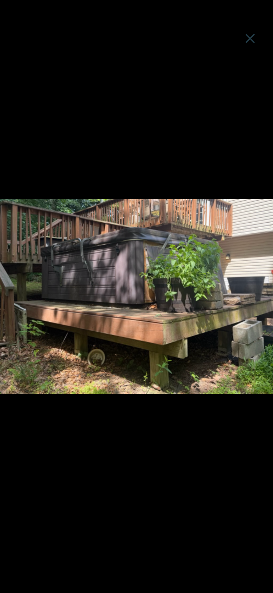 Hot tub removal — before, showing the tub on the deck.