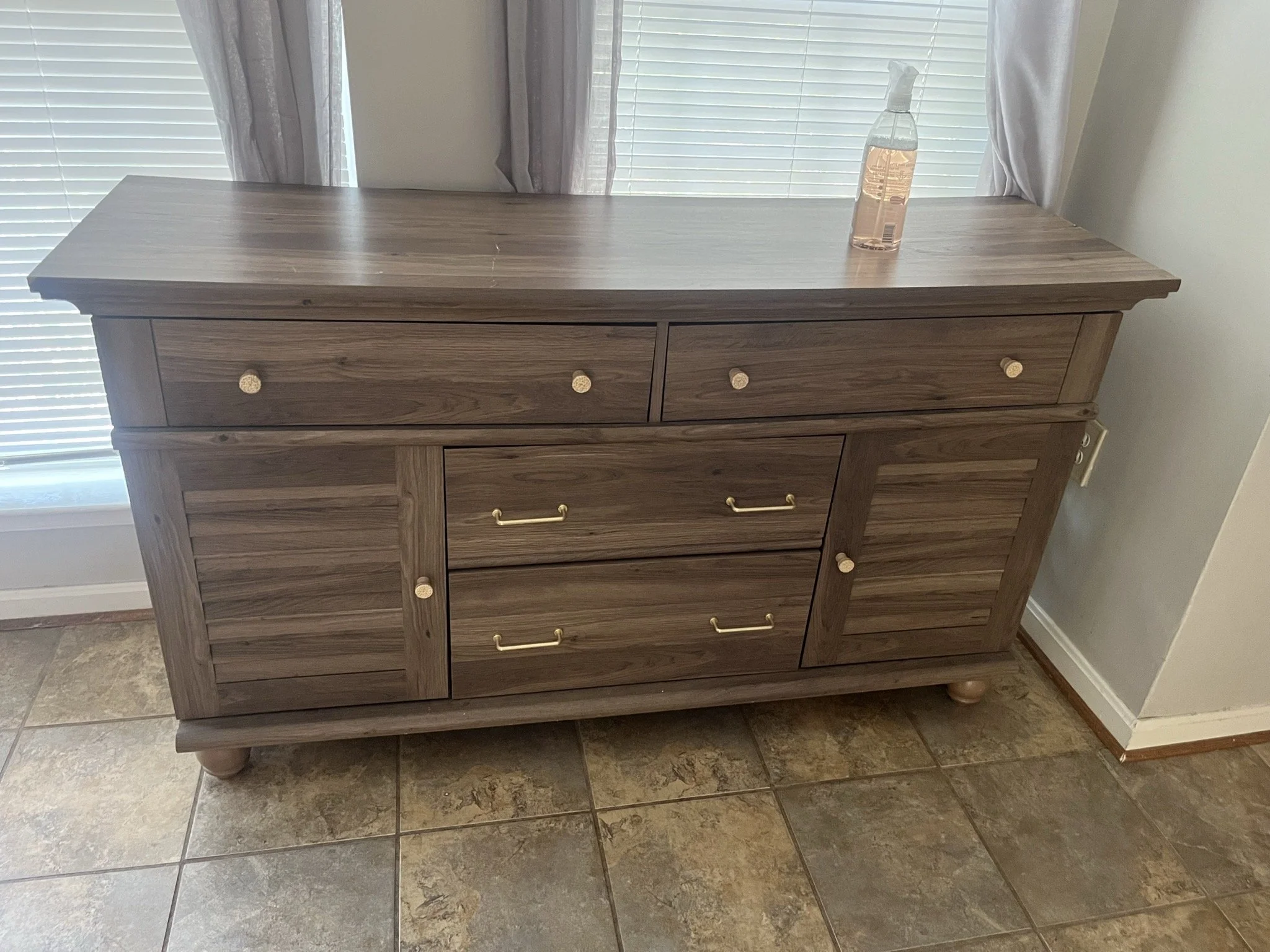 Ashburn move cleanout and donations — wooden sideboard.