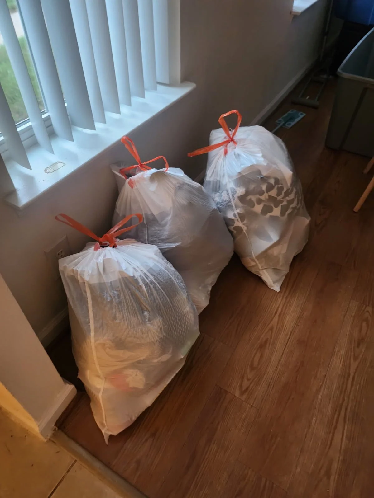 Quantico PCS move cleanup — bagged household items ready for pickup.