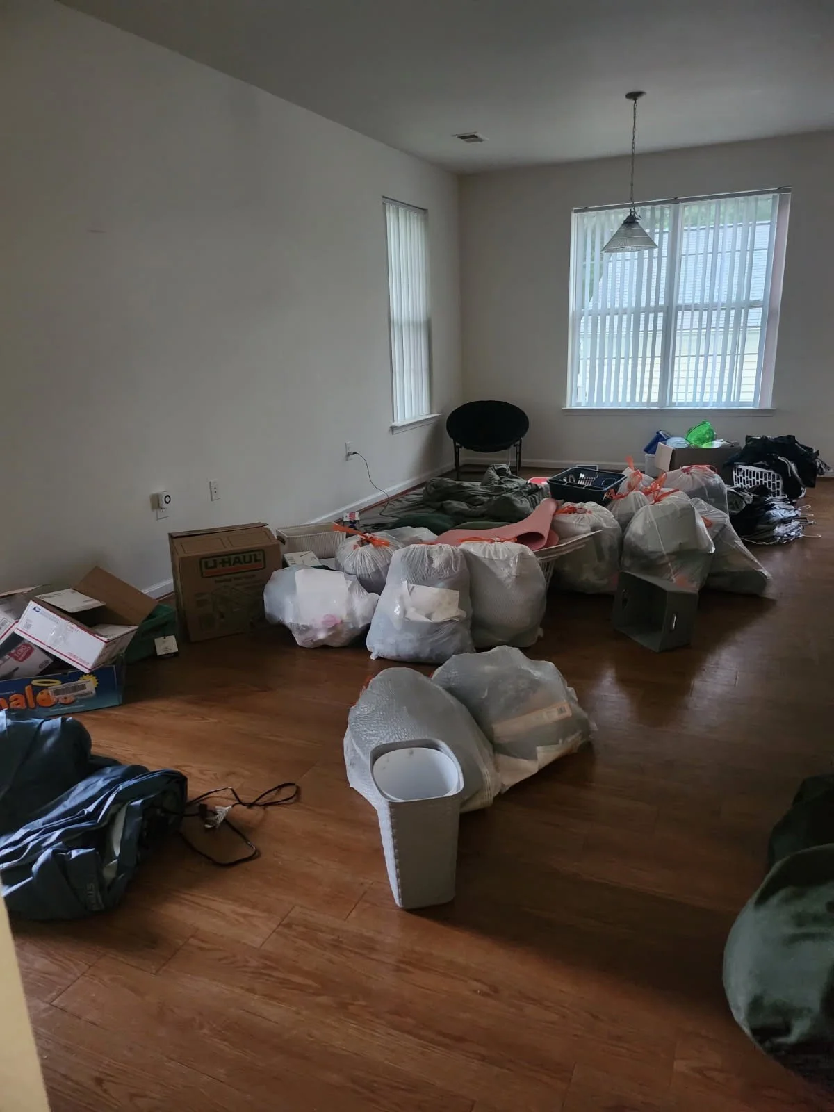Quantico PCS move cleanup — bagged household items awaiting pickup.