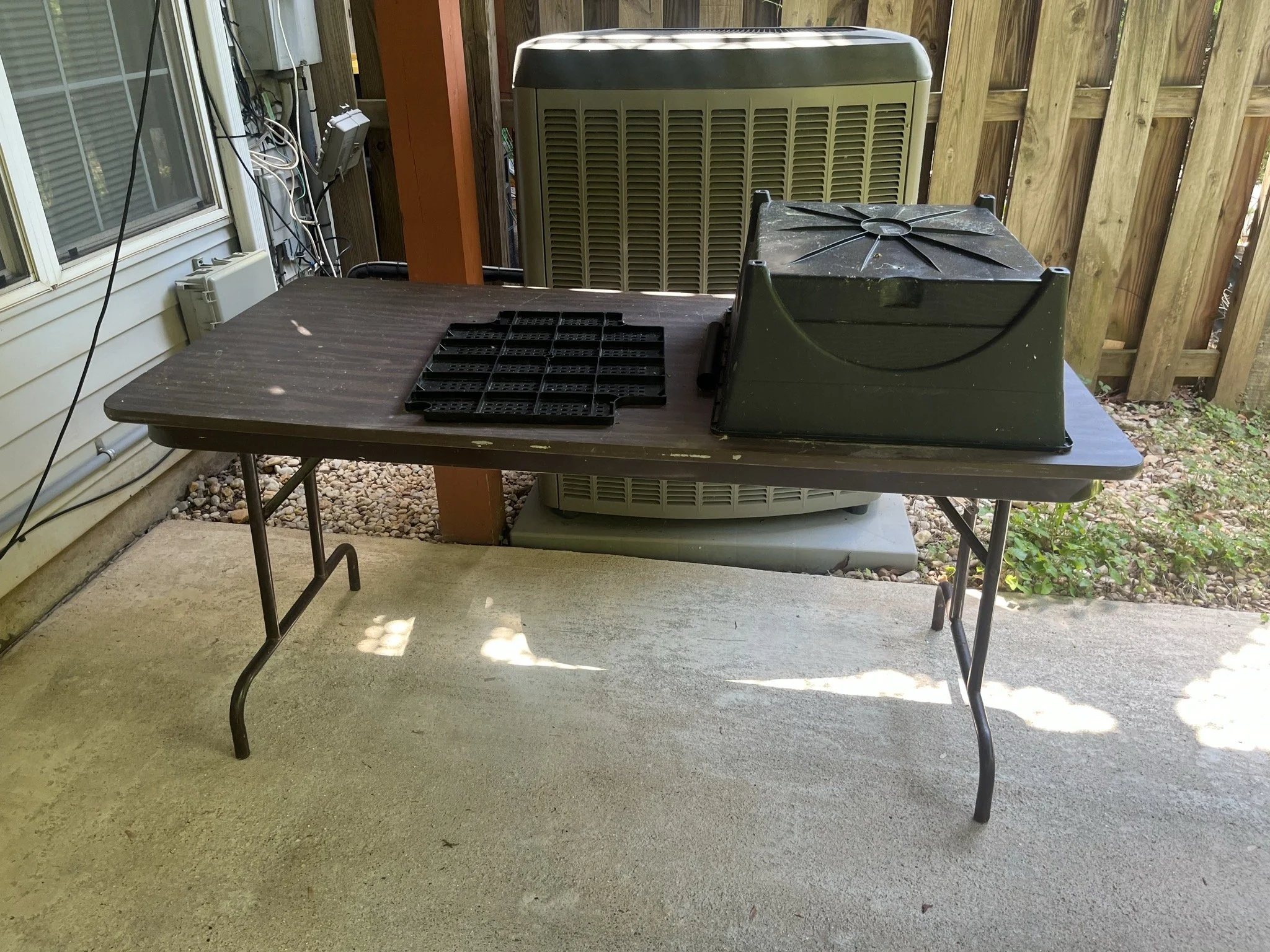 Ashburn move cleanout — outdoor table and assorted items.