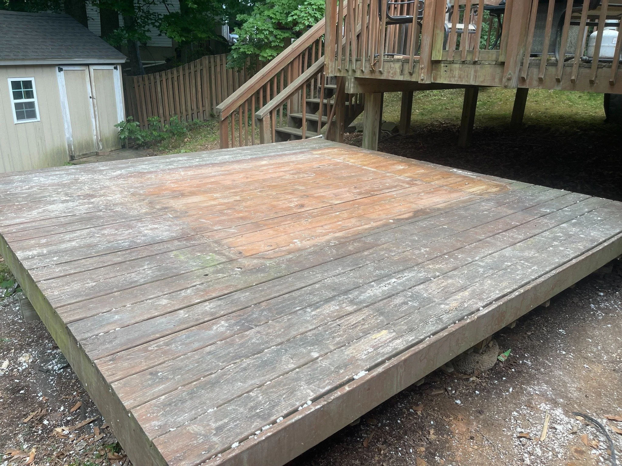 Hot tub removal — wider view of the cleared deck.