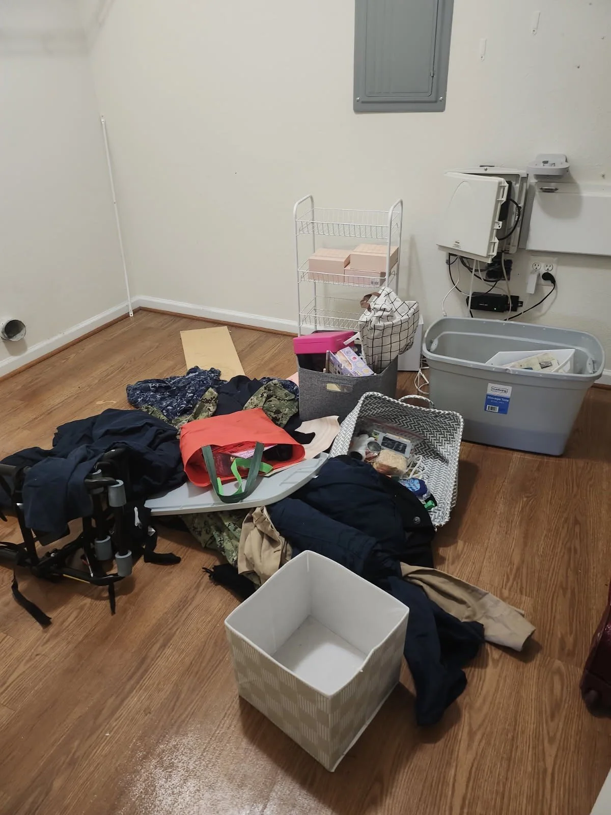 Quantico PCS move cleanup — storage bins and household items.