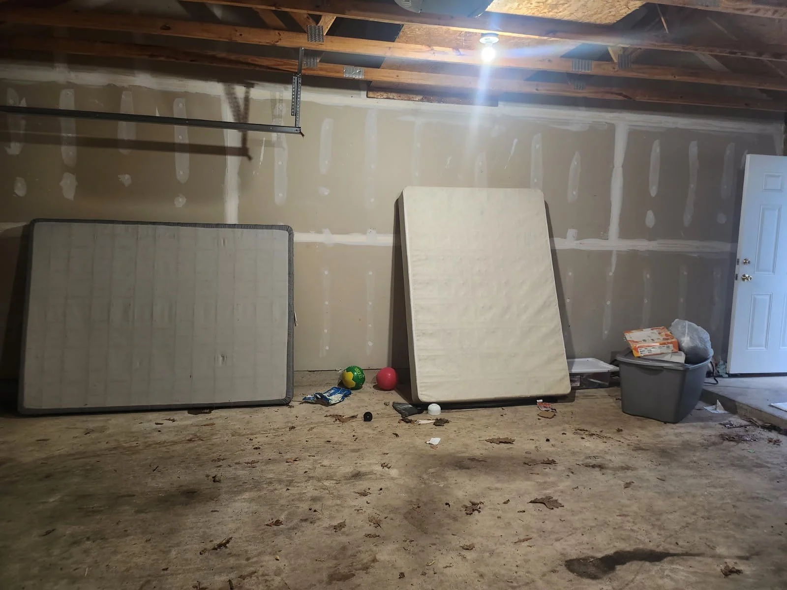 Quantico PCS move cleanup — mattresses awaiting removal in the garage.