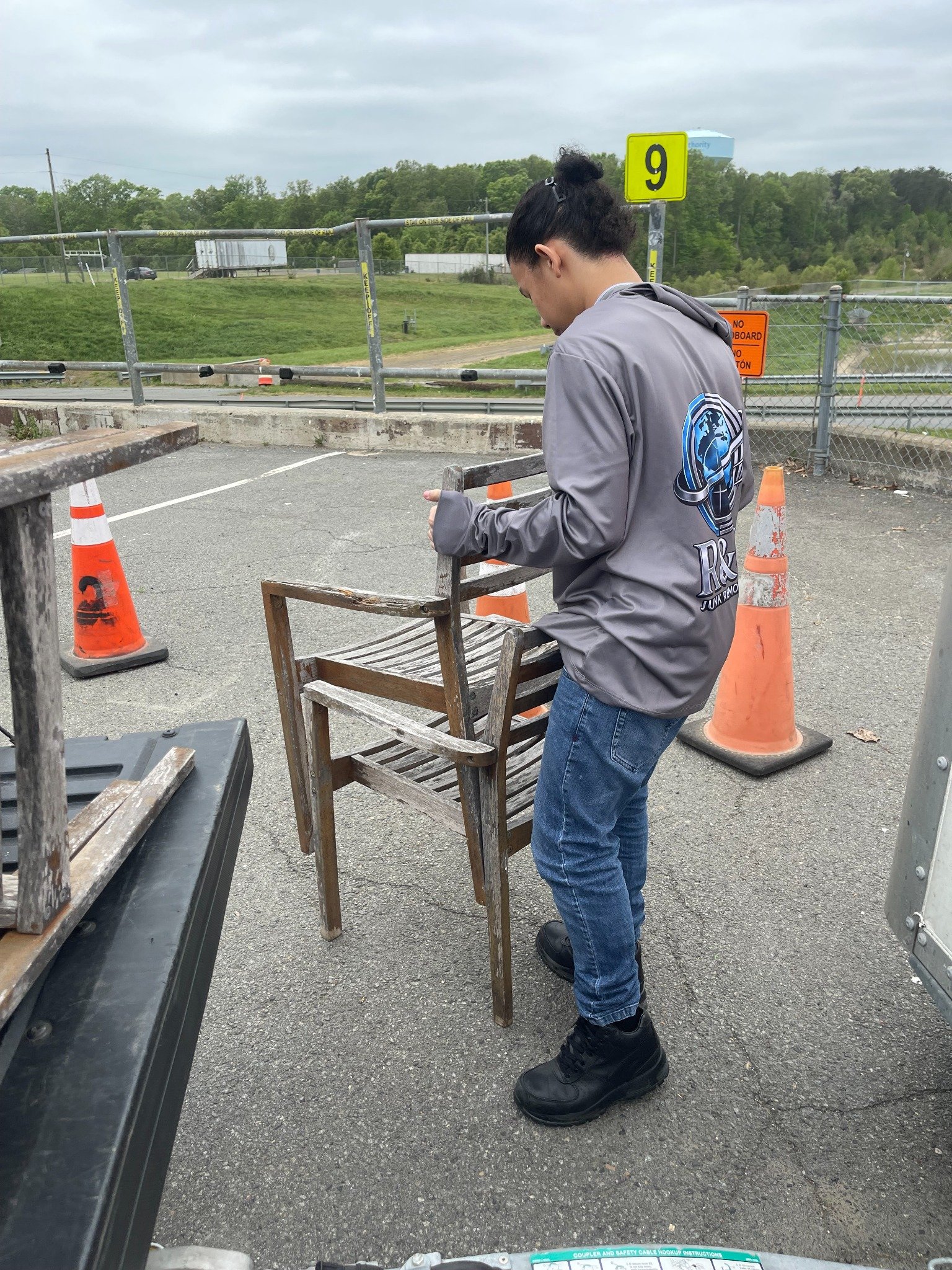 Ashburn move cleanout — crew handling a patio chair.
