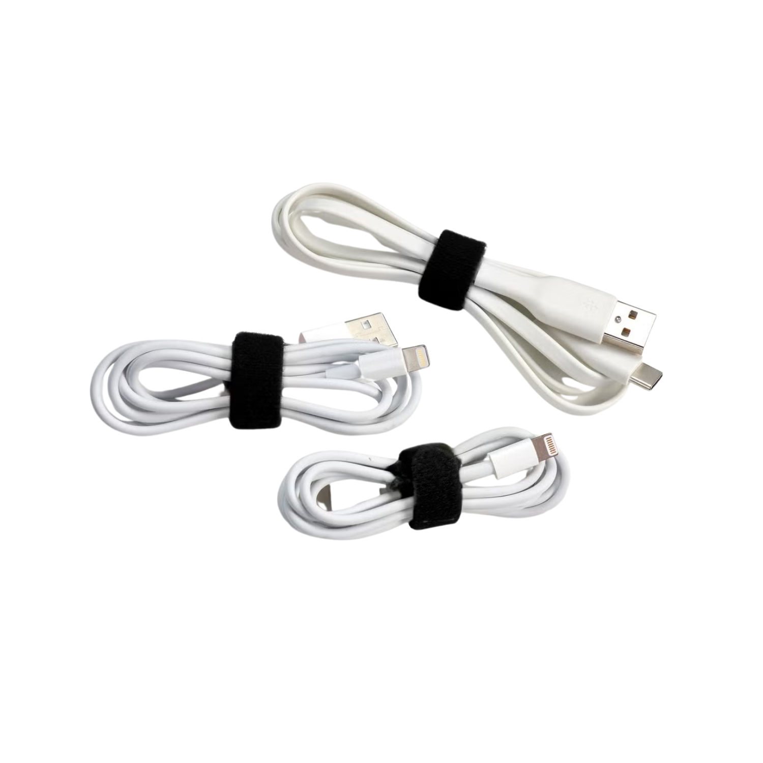 Three white charging cables with black velcro straps, for electronic devices.