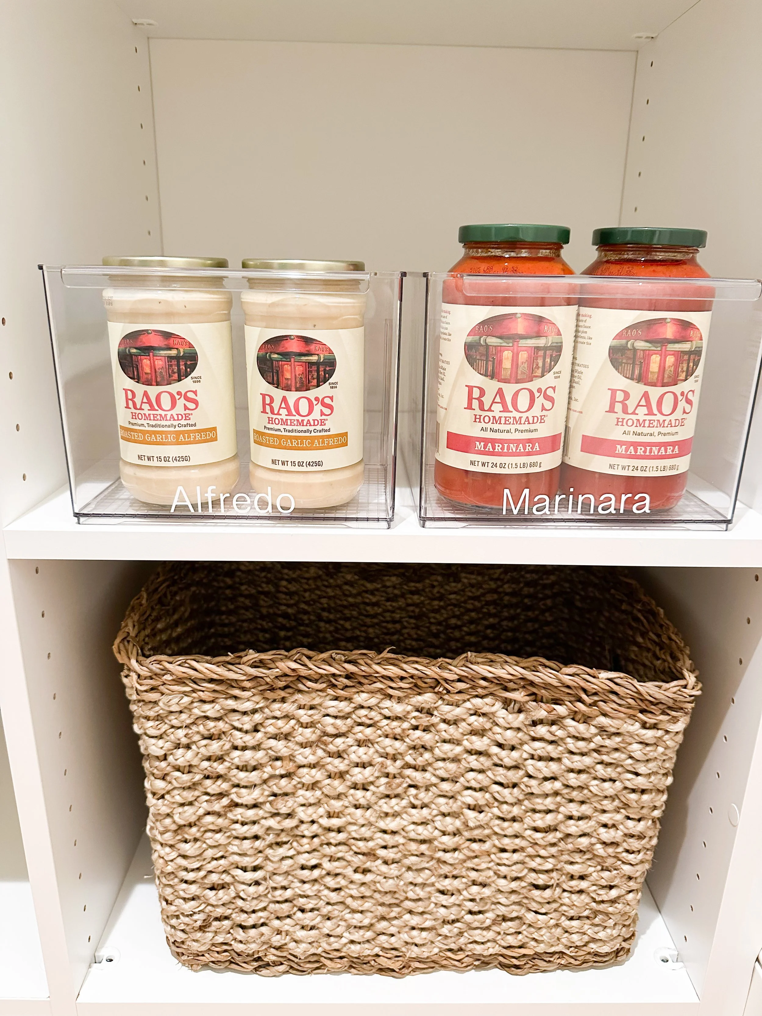 Shelf with two containers of Rao's Alfredo sauce and two jars of Rao's Marinara sauce above a woven basket.