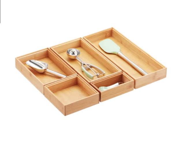 Wooden kitchen utensil organizer with various utensils inside
