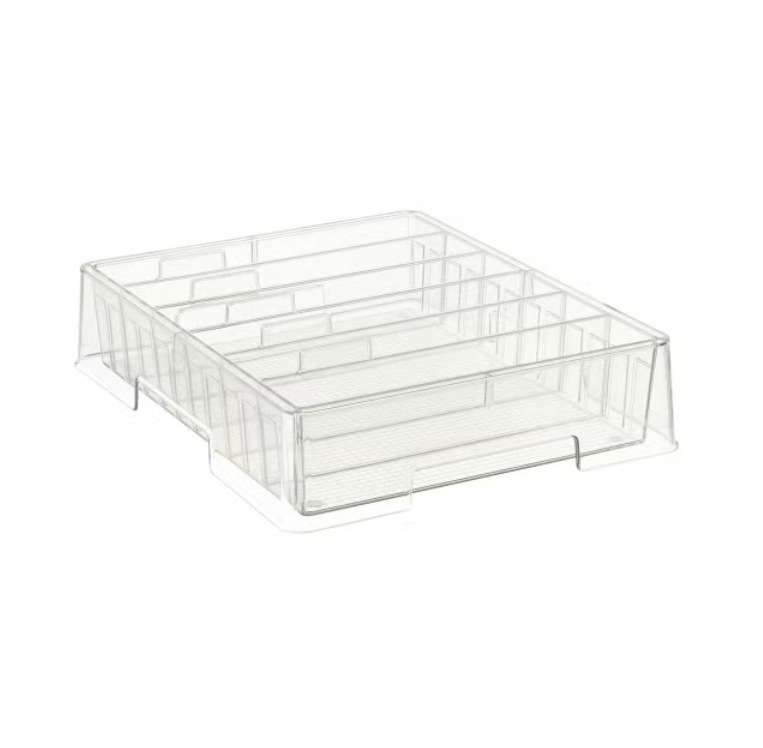 Clear plastic organizer tray with multiple compartments for storing small items.