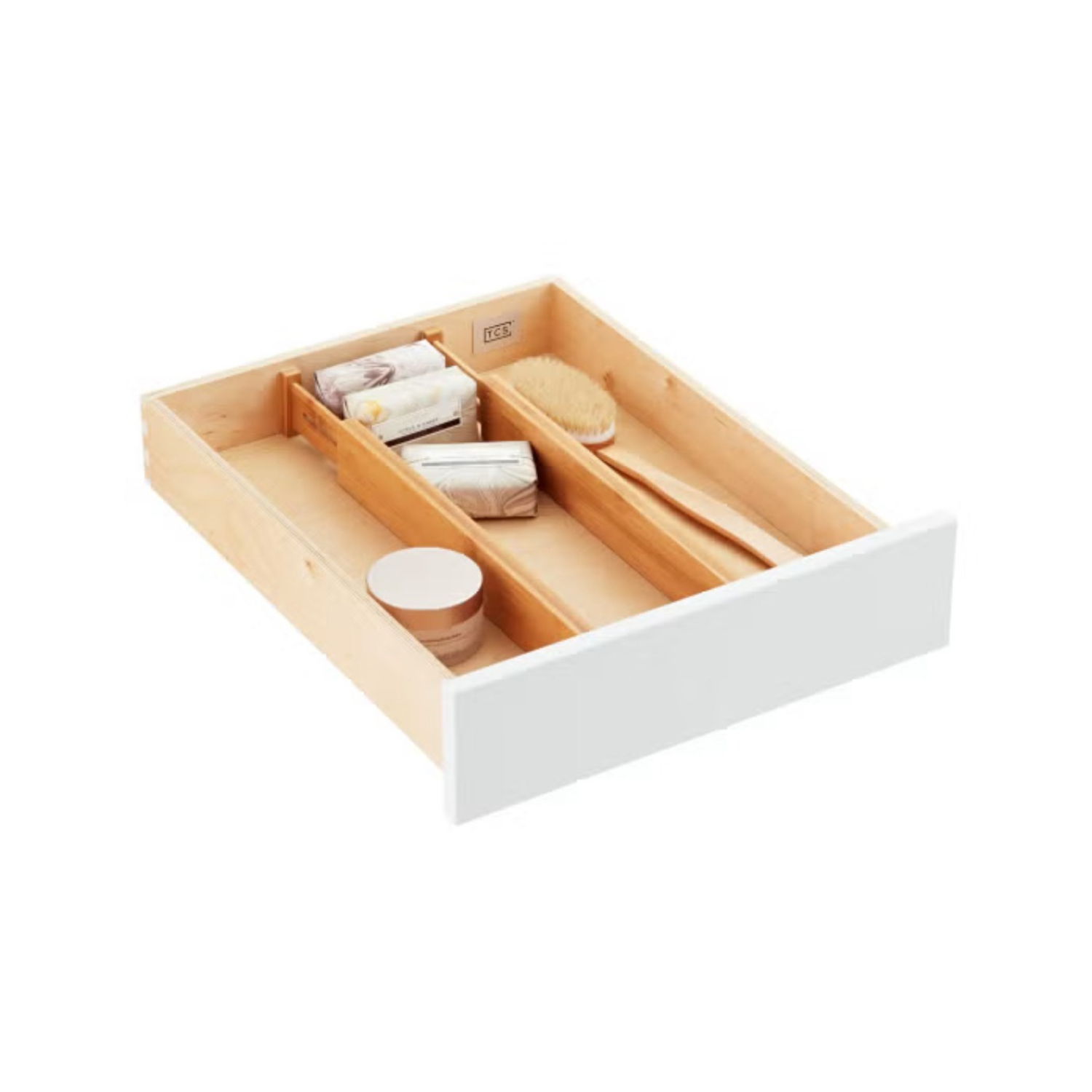 Open wooden drawer with soap, sponge, and toiletries.