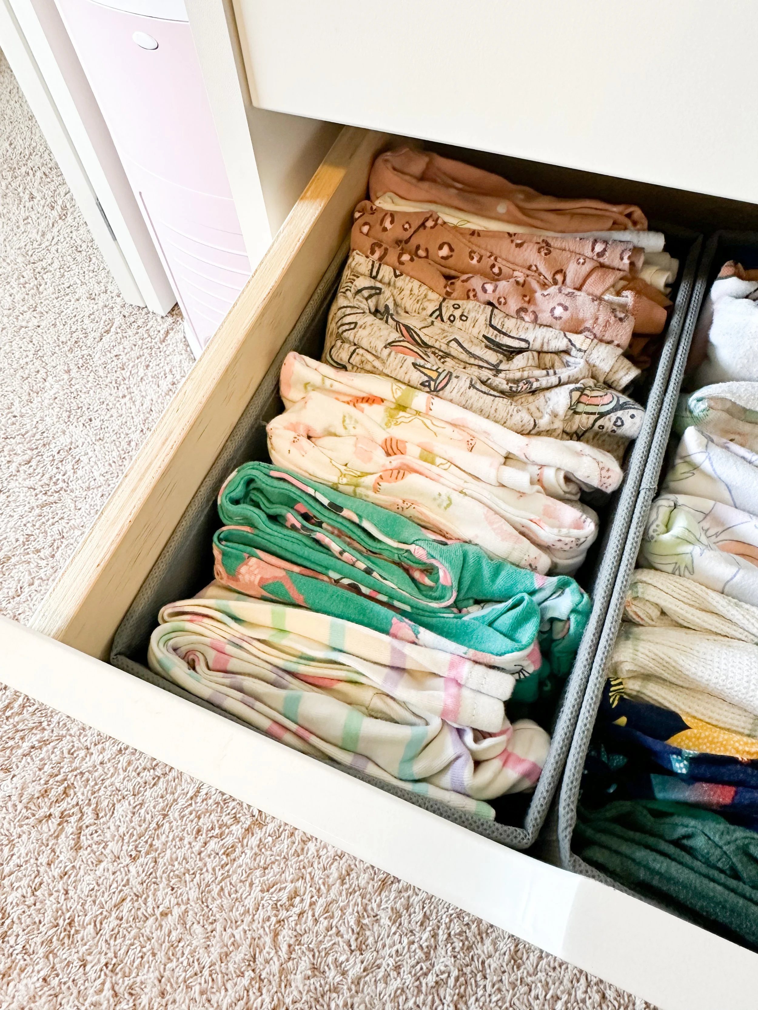 Open drawer with neatly folded colorful socks and underwear.