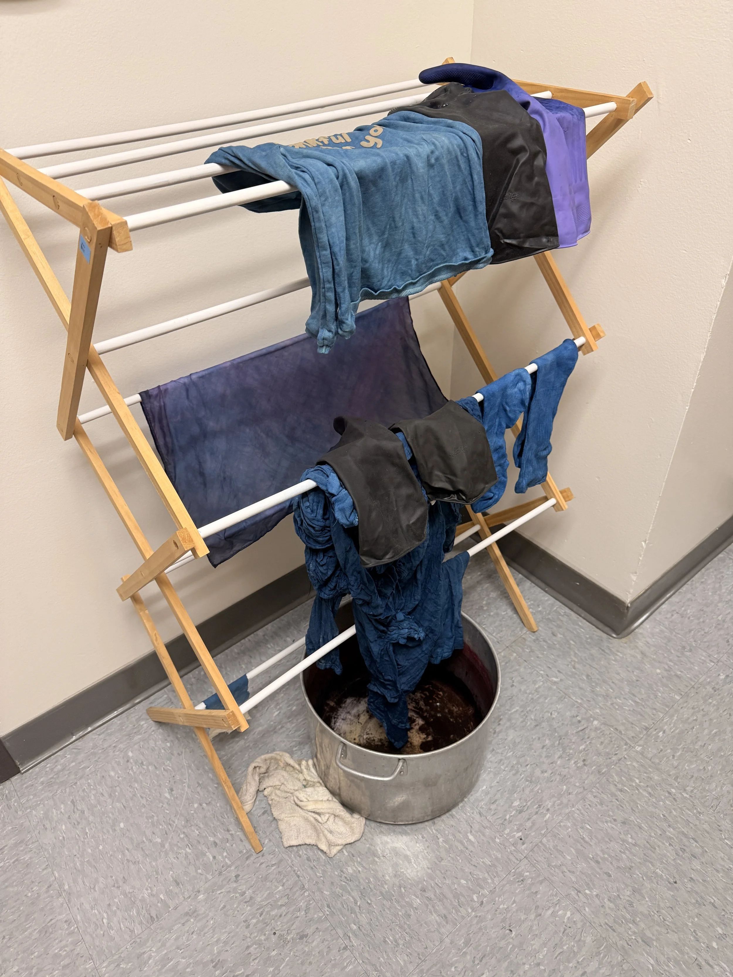 Freshly dipped items from the indigo vat.  A lot of deep, dark blues.  The color lightens as the dye sets.